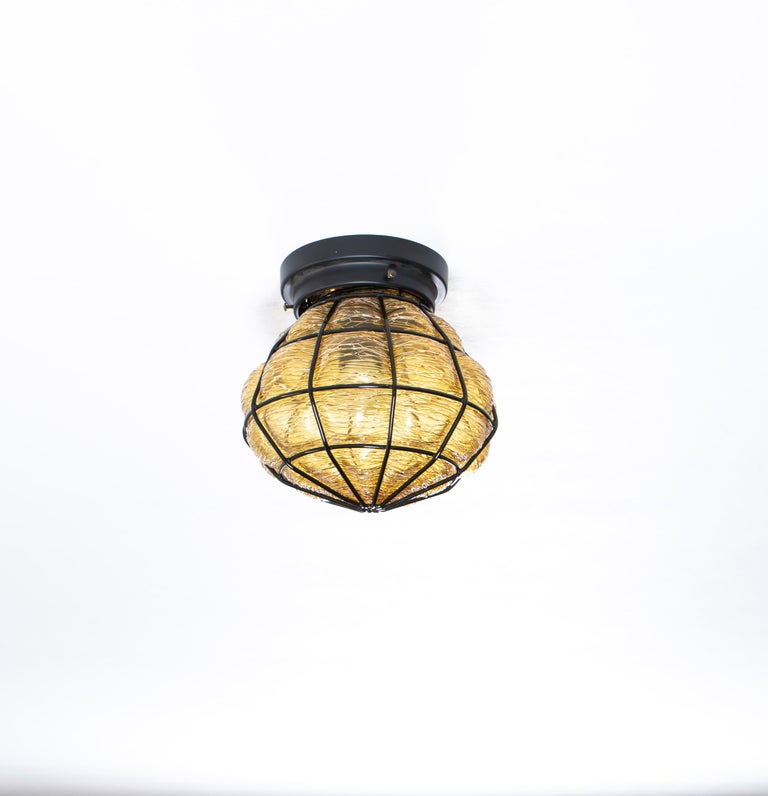 Decorative flush mount ceiling lamp in blown glass on a metal wire frame. Designed and made in Norway from circa 1970s first half. The lamp is fully working and in good vintage condition. The lamp is fitted with one E27 bulb holder (works in the US)