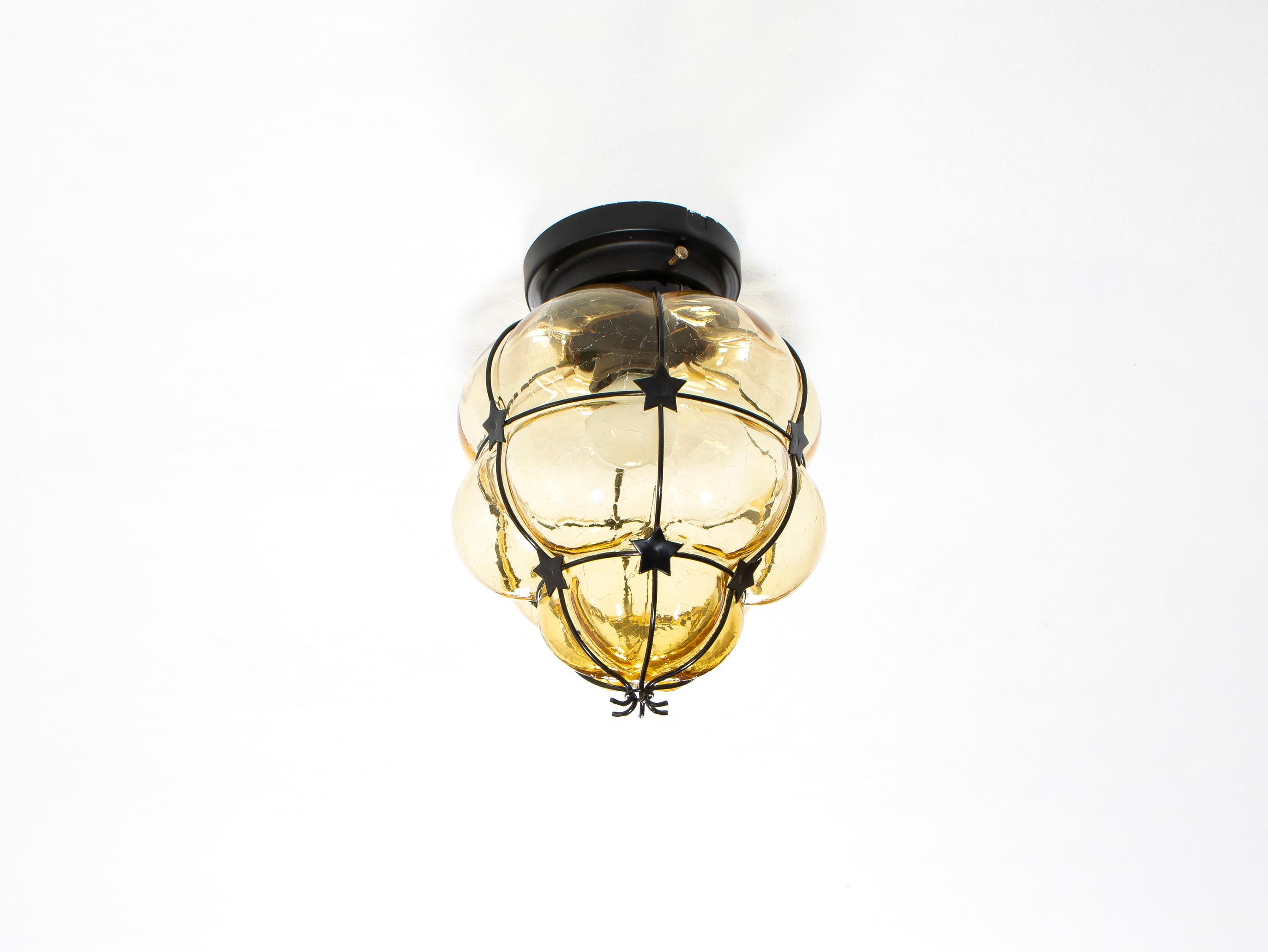 Wonderful flush mount ceiling lamp in blown glass on a metal wire frame. Designed and made in Norway from circa 1970s first half. The lamp is fully working and in good vintage condition. The lamp is fitted with one E27 bulb holder (works in the US)