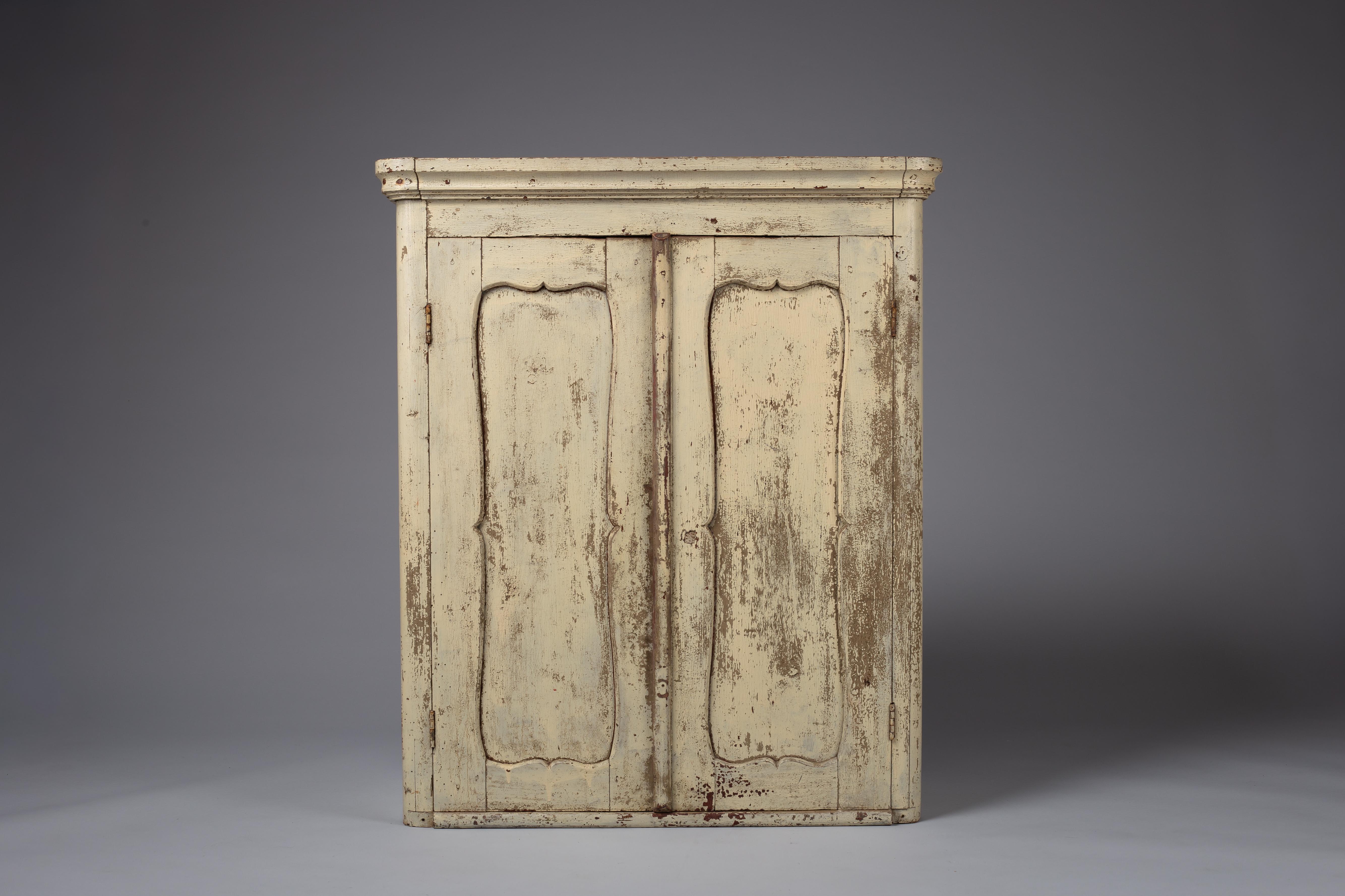 Discover a touch of history with this captivating 19th-century peasant cabinet, a testament to exquisite Scandinavian folk art. Exhibiting a beautiful patina that speaks to its age and authenticity, this decorative piece effortlessly enhances any