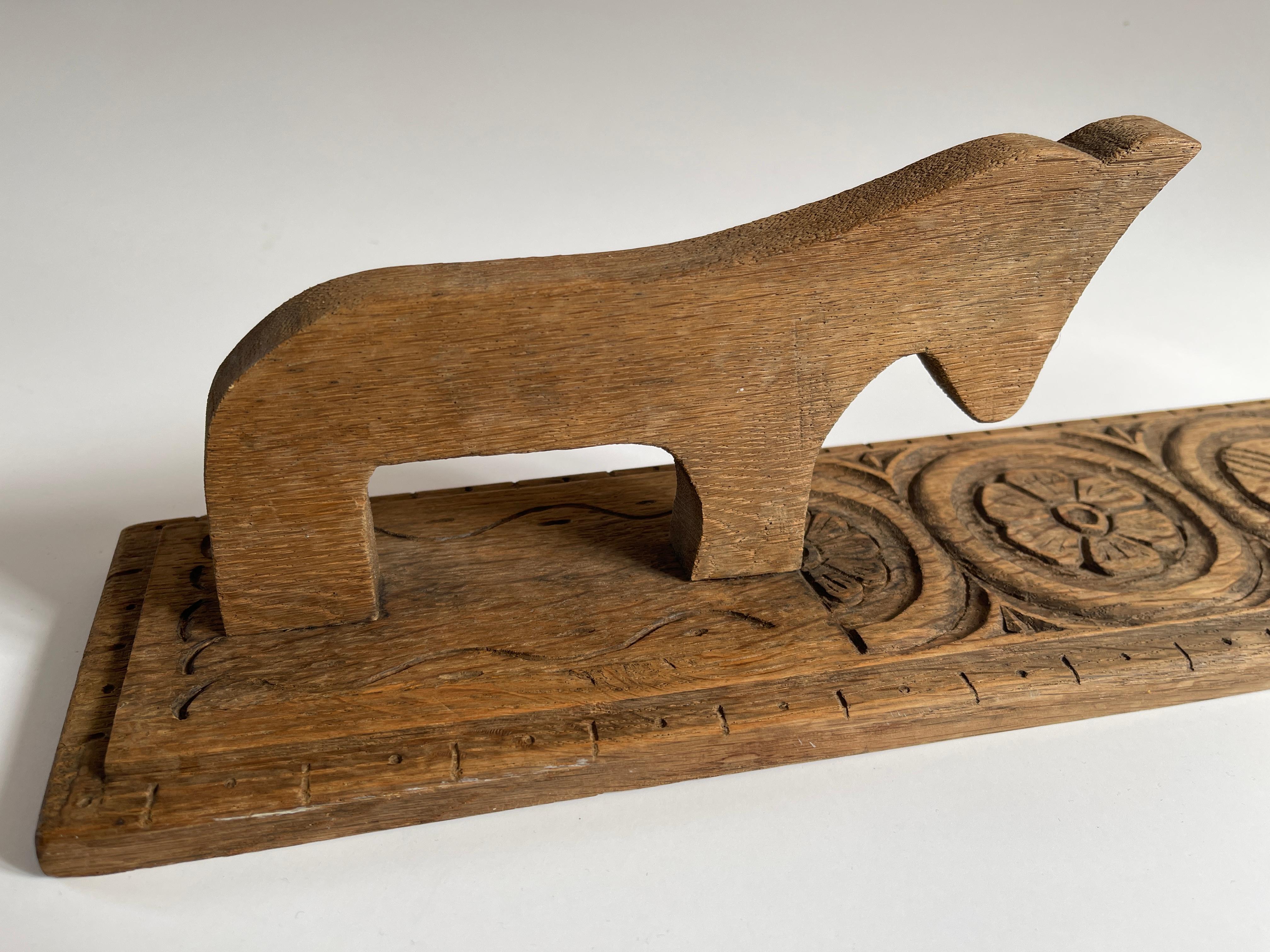 Scandinavian folk art mangle board, hand carved oak with traditional designs. Carved wooden horse was used as handle for pressing linen.
Mangle boards were given as a wedding gift from the groom to the bride. The suitor would hang the board on the