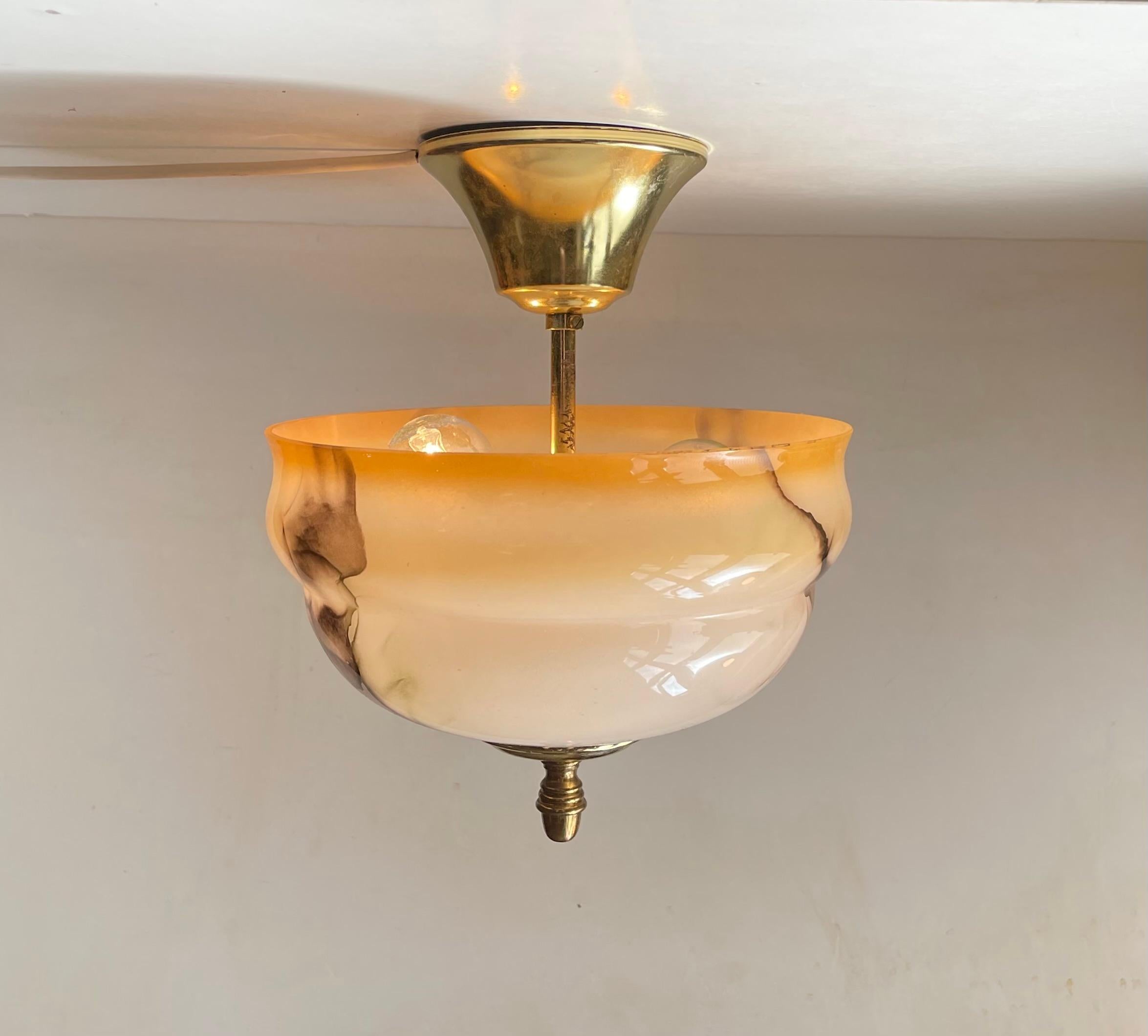 Flush mount ceiling light with two bulbs. Composed of a marbled opaline glass shade with brass hardware. Unknown Scandinavian/Danish maker circa 1960-70. Functionalist - Art Deco revival in style. Measurements: D: 22 cm, H: 25 cm. 3 meters new white