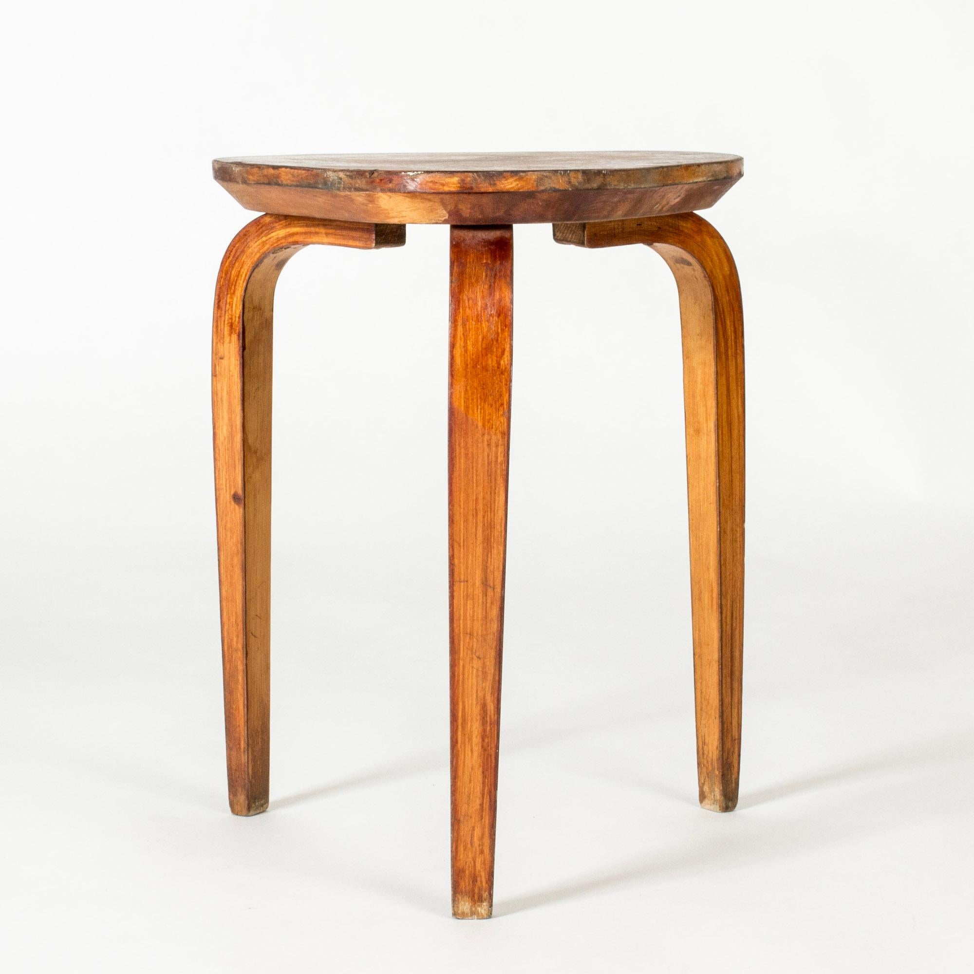 Cool wooden stool by G. A. Berg, in a clean functionalist design with a rounded triangular seat and bentwood legs.