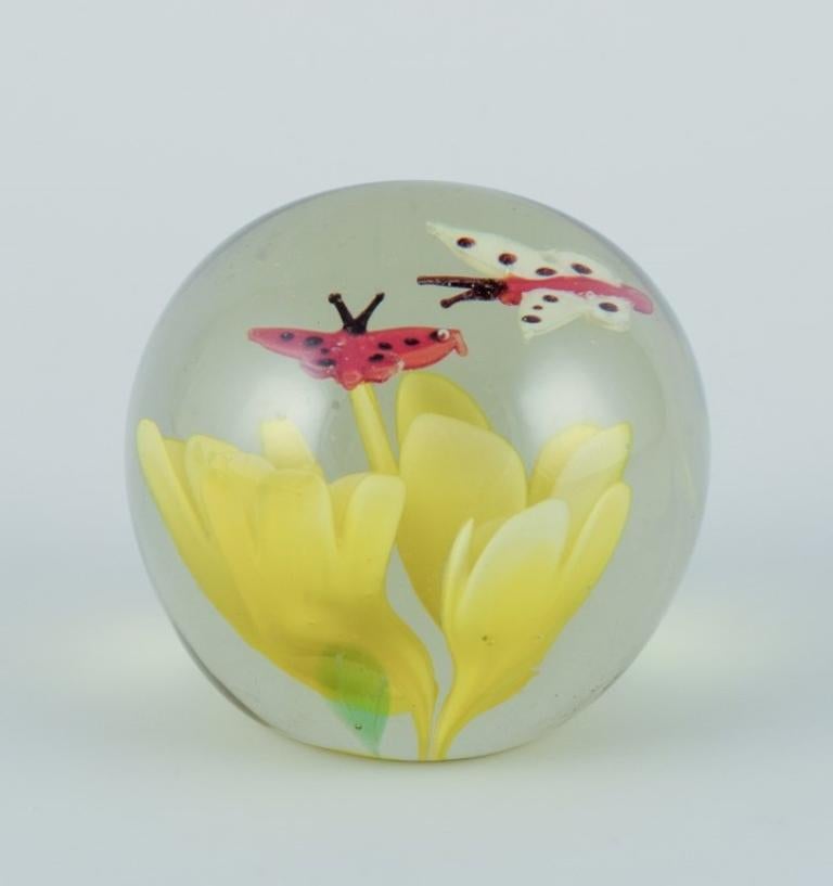 Late 20th Century Scandinavian glass artist. Four paperweights in art glass. Flower motifs. For Sale