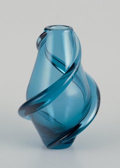 Scandinavian glass artist. Handmade art glass vase in turquoise glass.