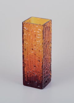 Scandinavian glass artist. Large art glass vase in amber-colored glass.