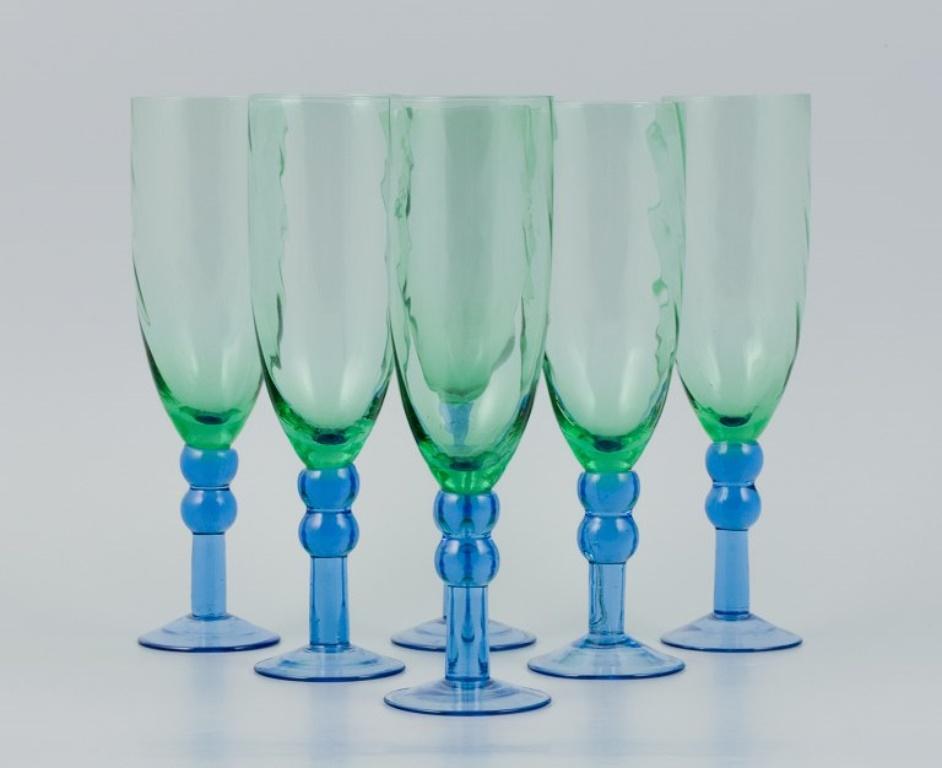 Scandinavian glass artist.
Set of six hand blown champagne glasses in green and blue glass.
Late 1900s.
In perfect condition.
Dimensions: H 22.0 x D 6.0 cm.