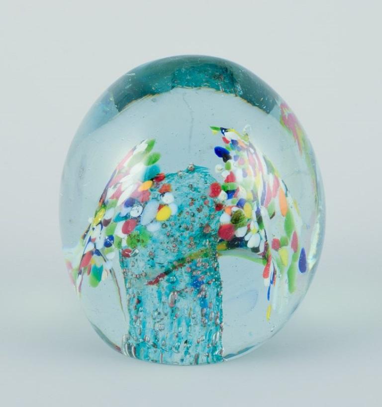 Late 20th Century Scandinavian glass artist. Set of three paperweights in art glass. Flower motifs For Sale