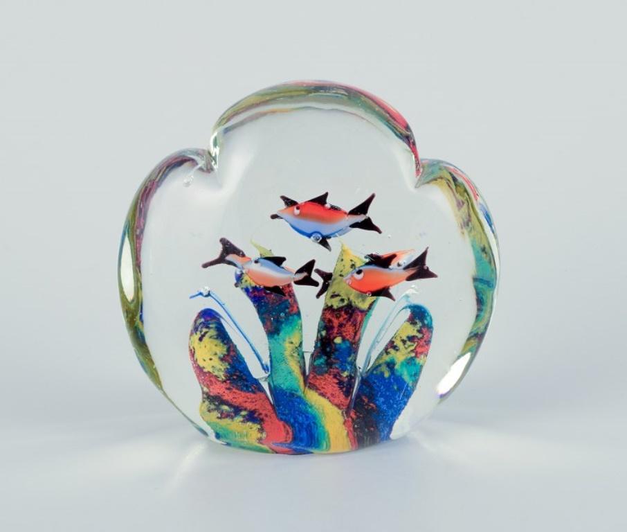Scandinavian glass artist. Set of three paperweights in art glass. 
Flower motif, aquarium, and apple embedded in the glass. Handmade.
Around the 1980s.
In perfect condition.
Dimensions: H 7.5 - 10.0 cm x D 6.0 - 10.0 cm.