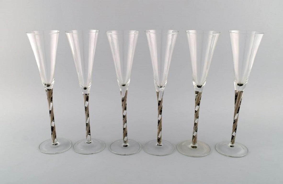 Scandinavian glass artist. Six champagne glasses in mouth-blown art glass. Late 20th century.
Measures: 28.5 x 7.5 cm.
In excellent condition.