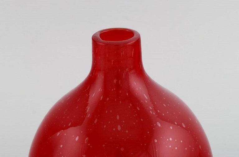 Scandinavian glass artist. Unique vase in red mouthblown art glass