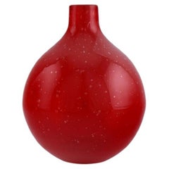 Scandinavian glass artist. Unique vase in red mouth-blown art glass.