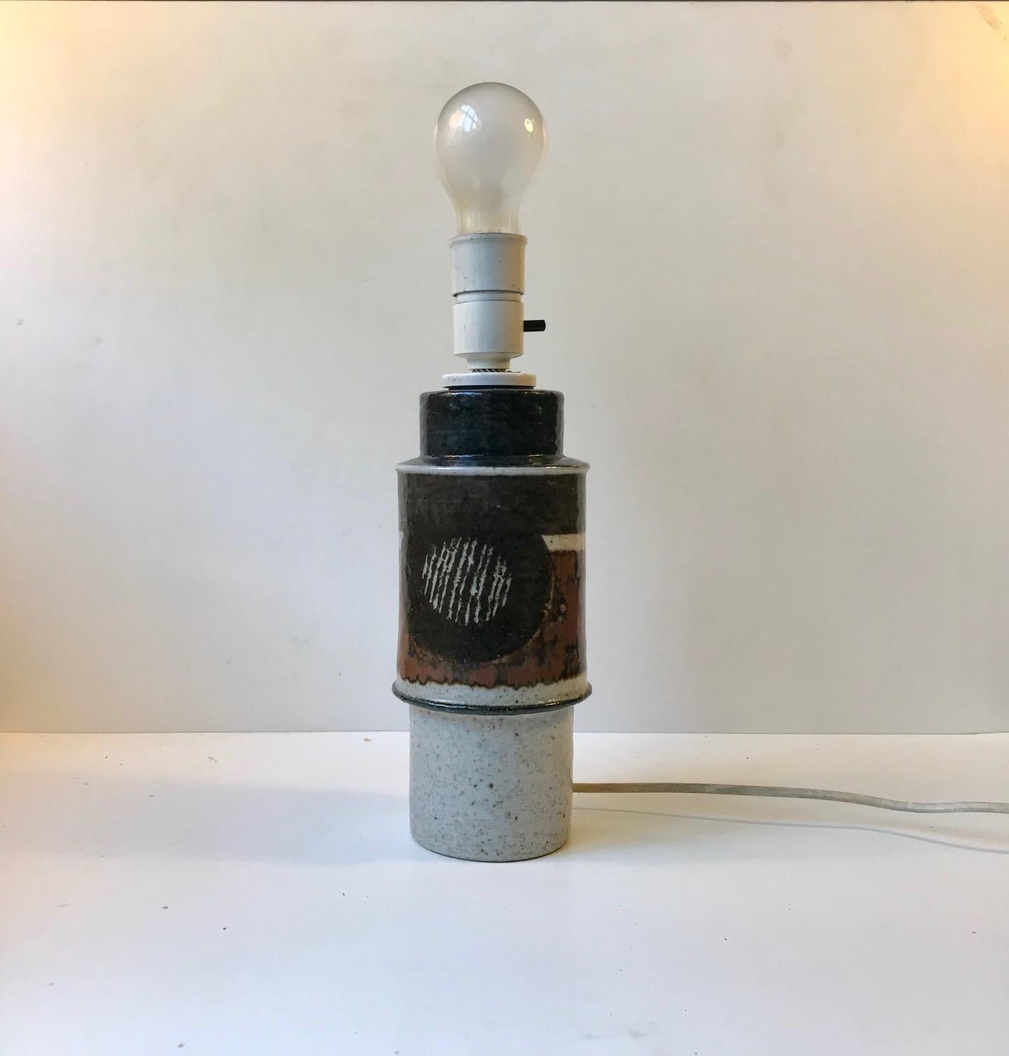 Inger Persson Studio/Ateljé stoneware table lamp. Rörstrand. Signed by hand: IP, Ateljé, Sweden. This light features on/of switch to the socket. The shade is not included. Please personalize with your own. Measurements: H: 38 cm with bulb, D: 12 cm