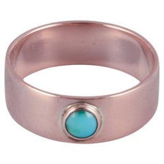 Scandinavian goldsmith. 14 karat gold ring adorned with a turquoise stone.