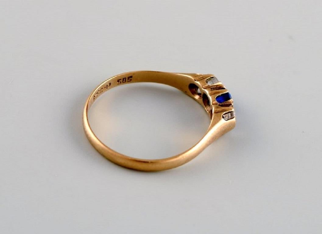 Scandinavian goldsmith. Vintage ring in 14-carat gold adorned with three semi-precious stones. 
Mid-20th century.
Diameter: 17 mm.
US size: 6.5.
In excellent condition.
Stamped.
In most cases, we can change the size for a fee (50 USD) per ring.