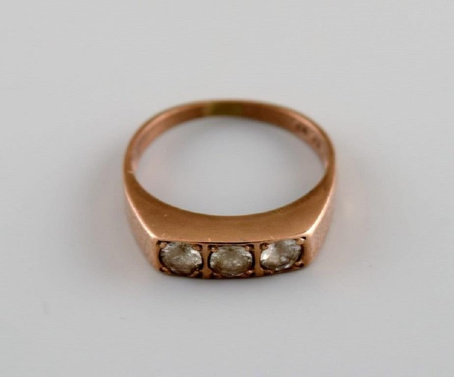 Scandinavian goldsmith. Vintage ring in 8-carat gold adorned with three semi-precious stones. 
Mid-20th century.
Diameter: 15.5 mm.
US size: 4.75.
In excellent condition. 
Measured to 8 carats by jeweler.
Stamped.
In most cases, we can change the