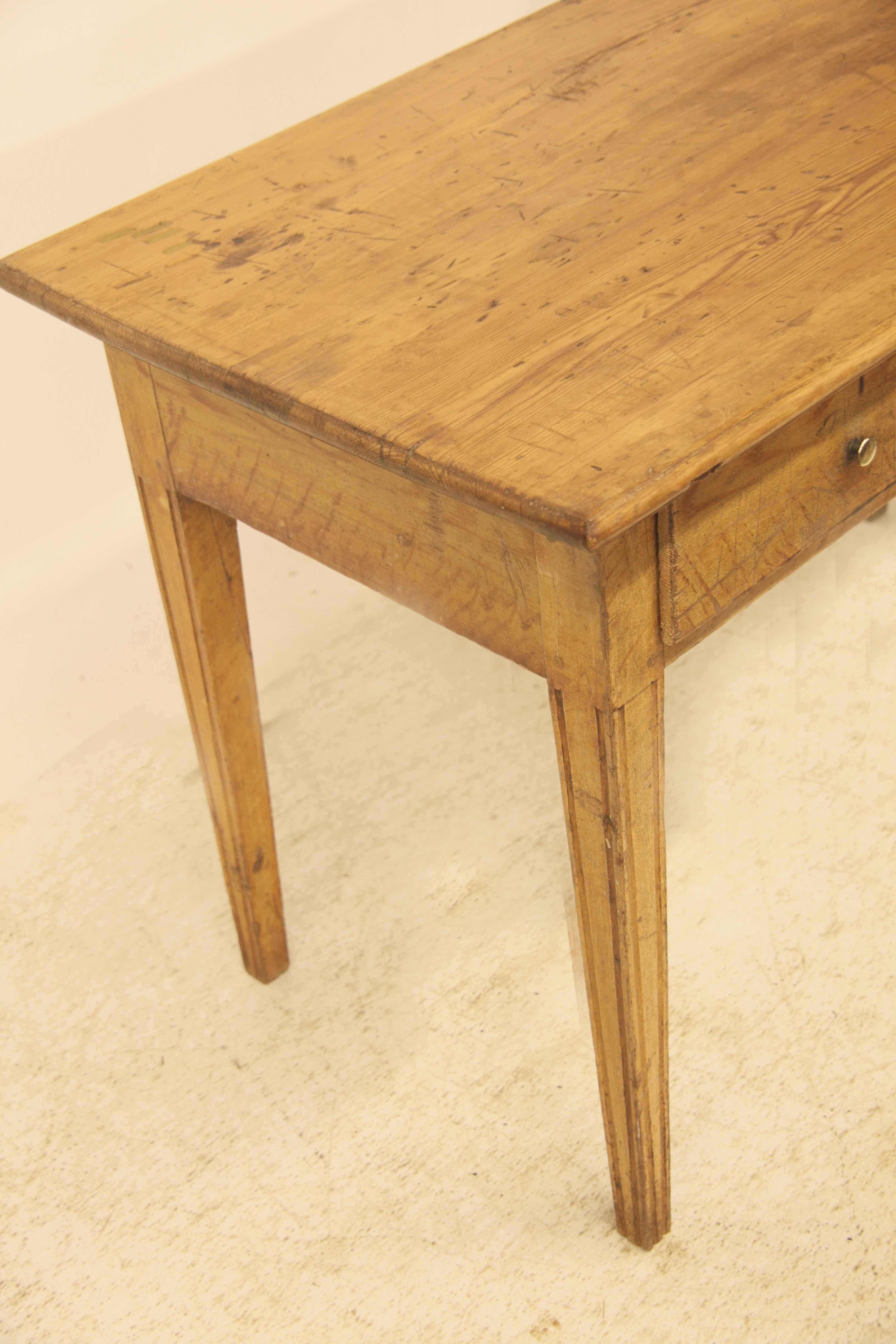 Scandinavian grain painted table , the scrub top ( no paint ) has much 'character' with some stains and scuffs but has nice patina and color.  The rest of the table is grain painted to simulate pine ( even the back is well done ) , the single drawer