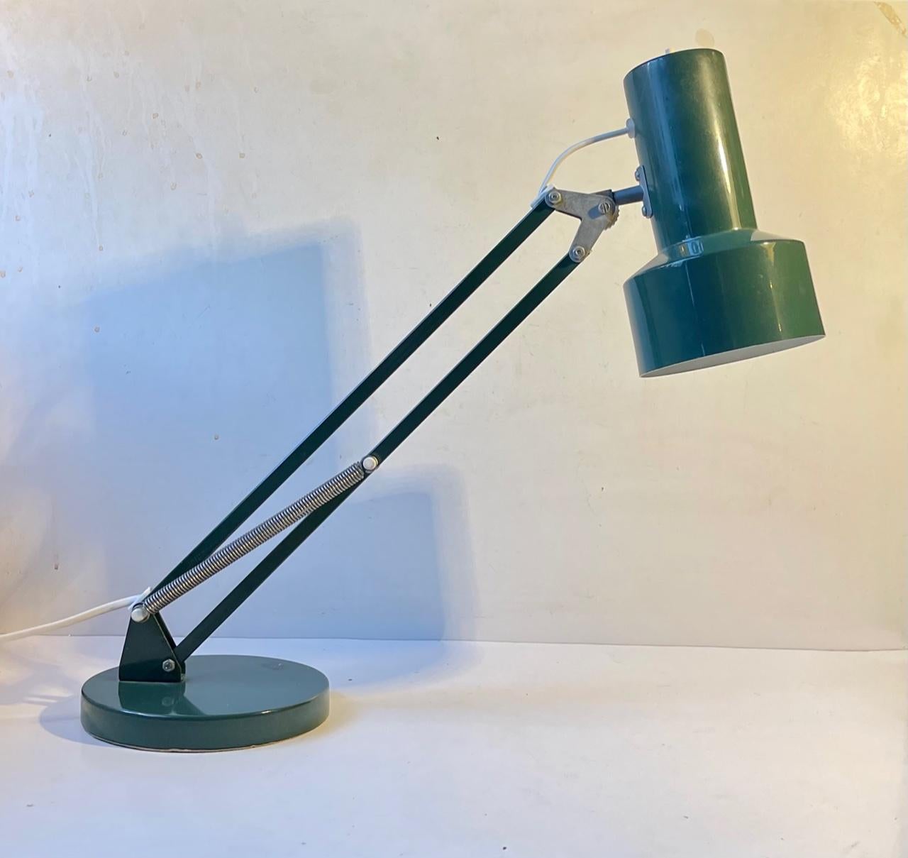 A rare teal green table lamp with fully adjustable stem and shade. In Denmark we call these architect table lamps due to their multi-functionality. It is made from powder coated aluminum and steel and is inspired by the English Anglepoise desk lamp