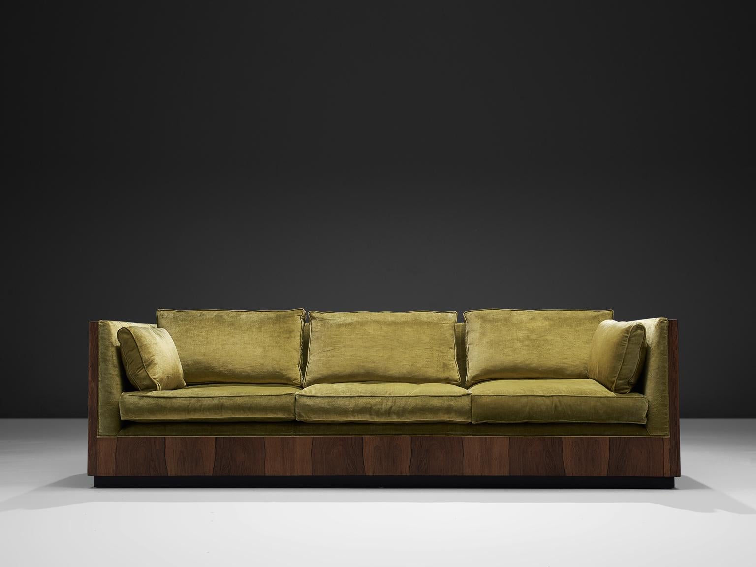 Sofa, green velvet, rosewood, Scandinavia, circa 1965

This three-seat 'basket' sofas is designed, circa 1965. The soft colored cushions fall perfectly in the rosewood frame of this settee. The design of this sofa is very geometric as the sides of