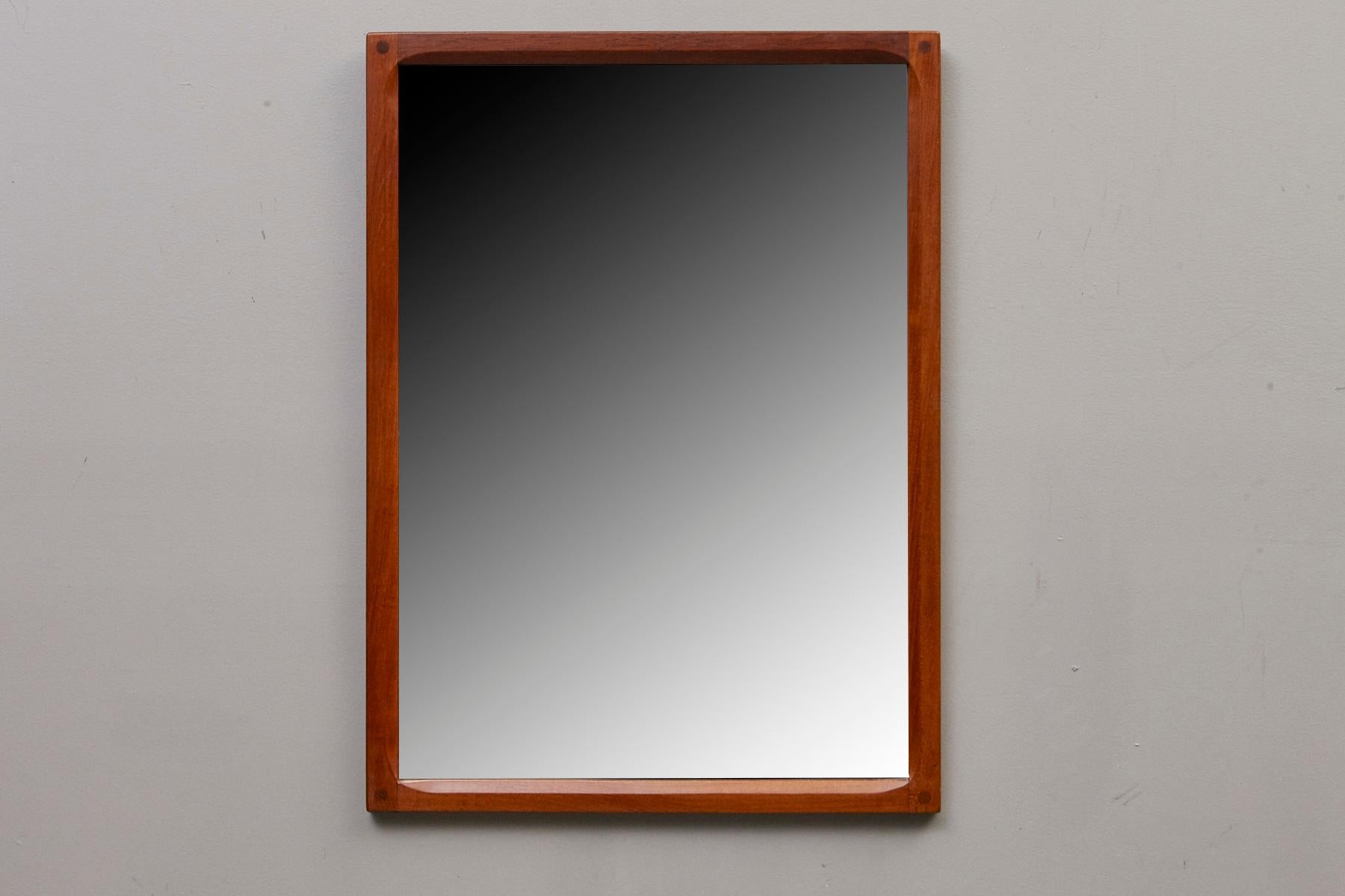 Beautiful handcrafted teak mirror clean lines and a Minimalist esthetic.
Intricate joinery and slightly rounded teak frame on the inside. The mirror has a beautiful patina.
Designed by Kai Kristiansen and manufactured by Aksel Kjersgaard A/S in