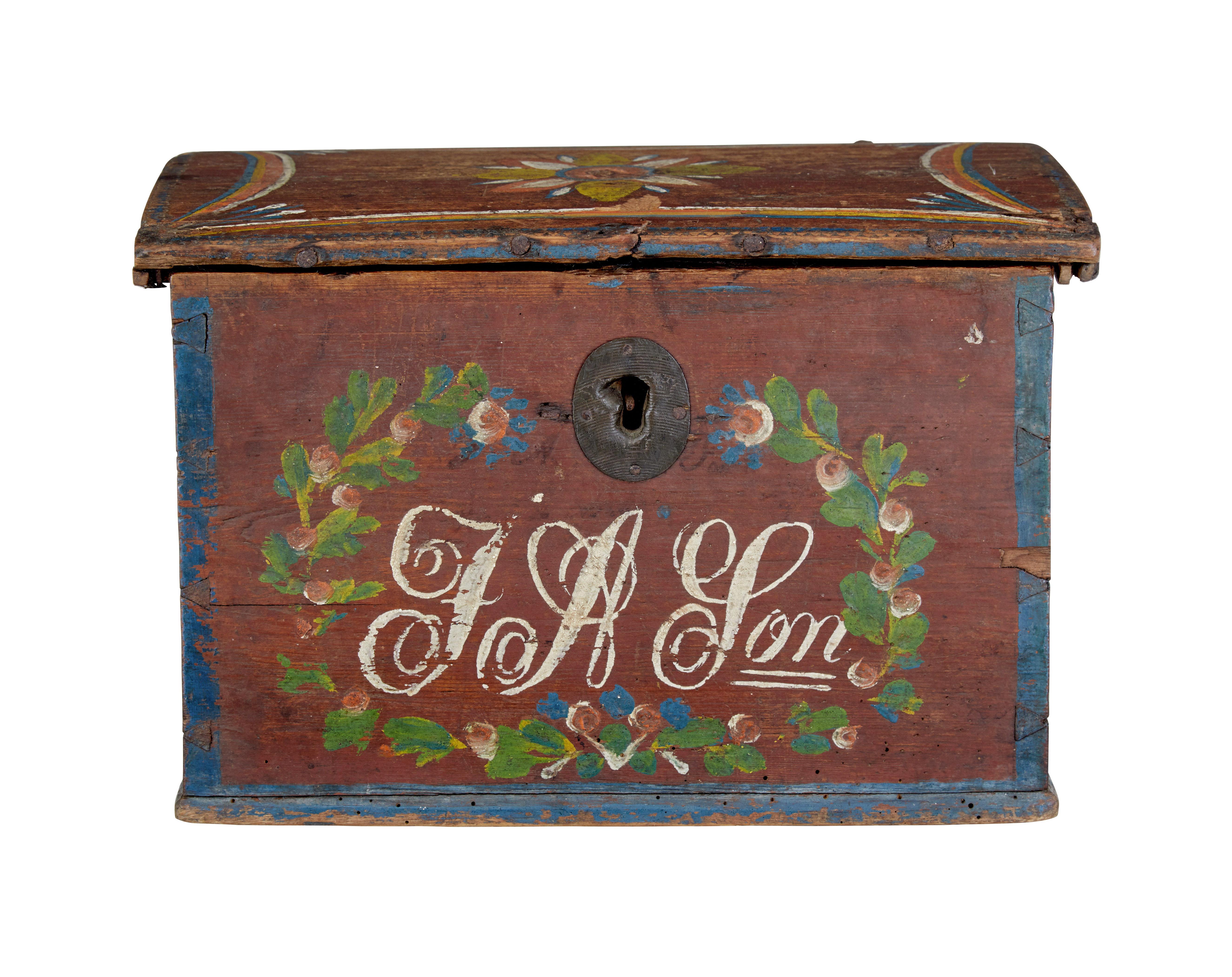 Scandinavian hand painted folk art pine box, circa 1850.

Fine example of traditional Swedish hand painted woodenware.

Slight dome topped lid which opens to reveal a unfitted interior. Plum coloured base colour, decorated in hand painted