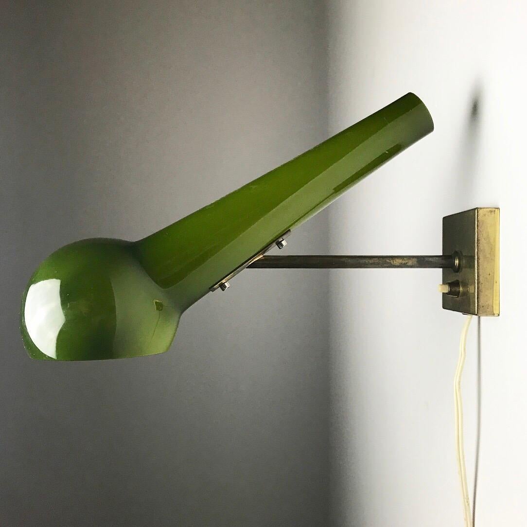 Extremely rare glass wall sconce made in Scandinavia early 1960s or late 1950s. 

The glass is of two layers (white inside and dark green outside) and hand blown. The base and rod is of solid brass and everything is of the highest built quality.