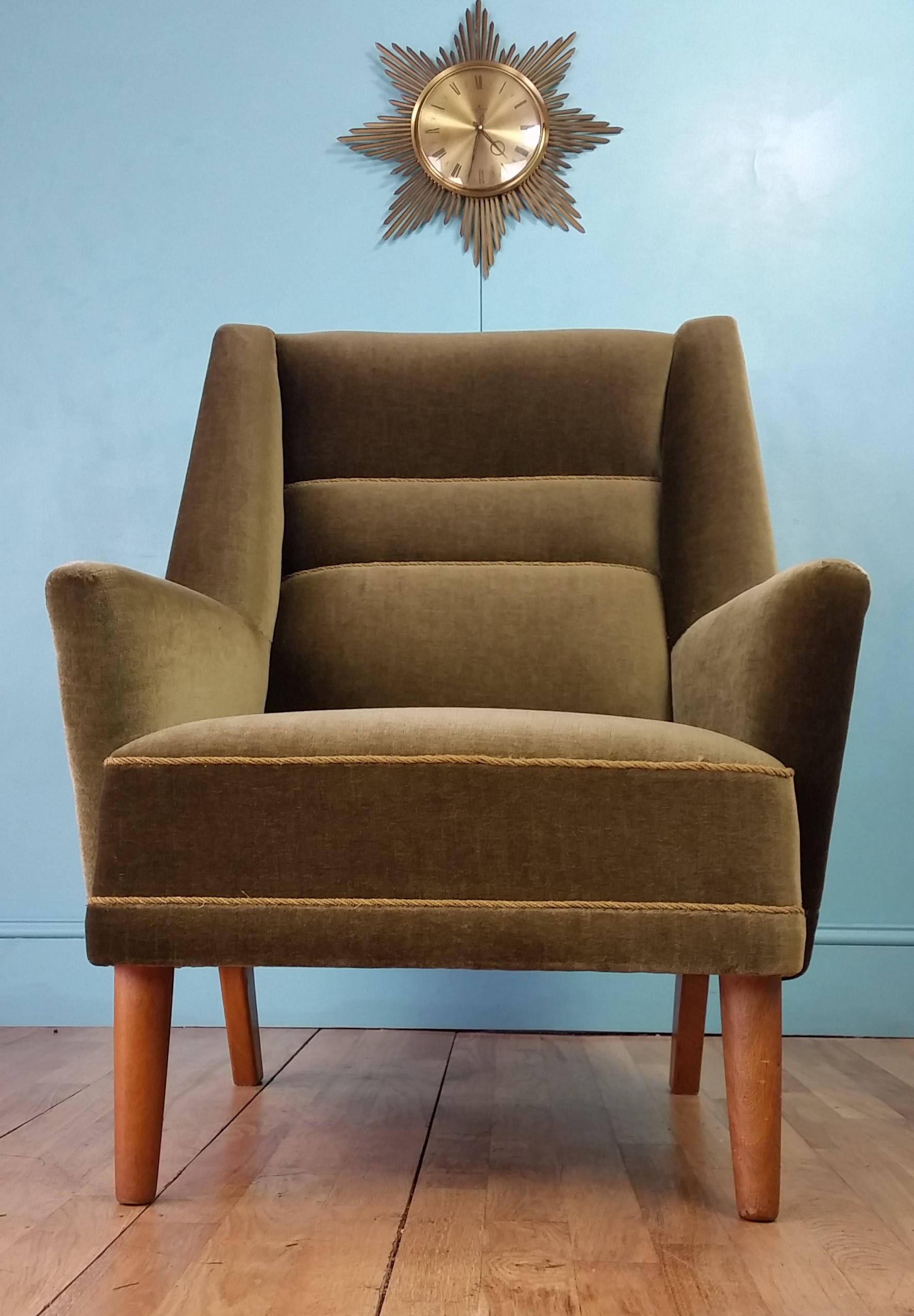 Danish mid century lounge chair circa 1960's.
Olive green velour upholstery with contrasting lighter detailing and teak legs.
Beautifully designed chair with a distinctive angular profile and a classic mid century Scandinavian look.
In excellent
