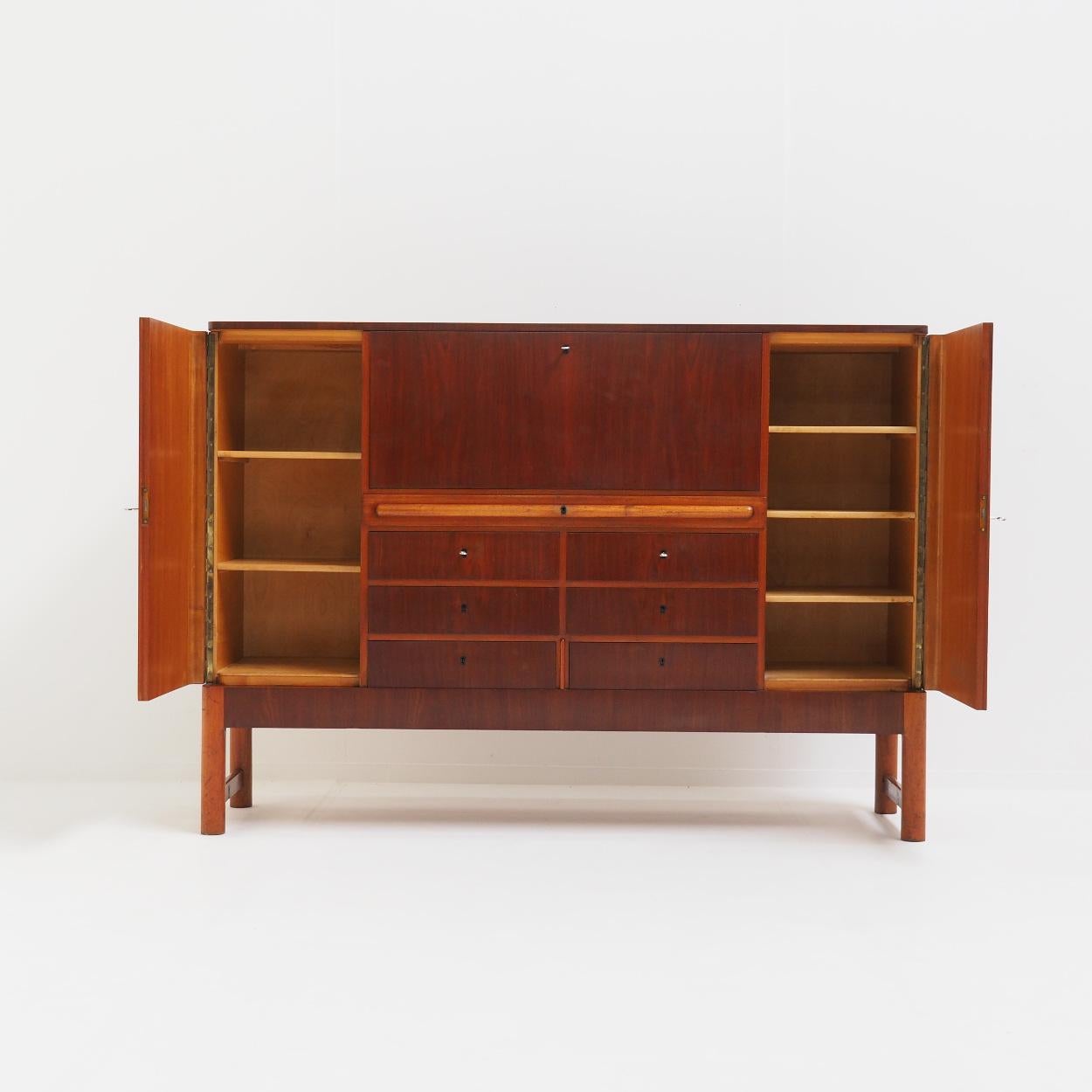 Scandinavian high quality cabinet from the 1960s. Unfortunately I don’t know who the designer or manufacturer is.

The cabinet has a lot of storage space and consists of different types of wood. It has been completely refinished and restored by my