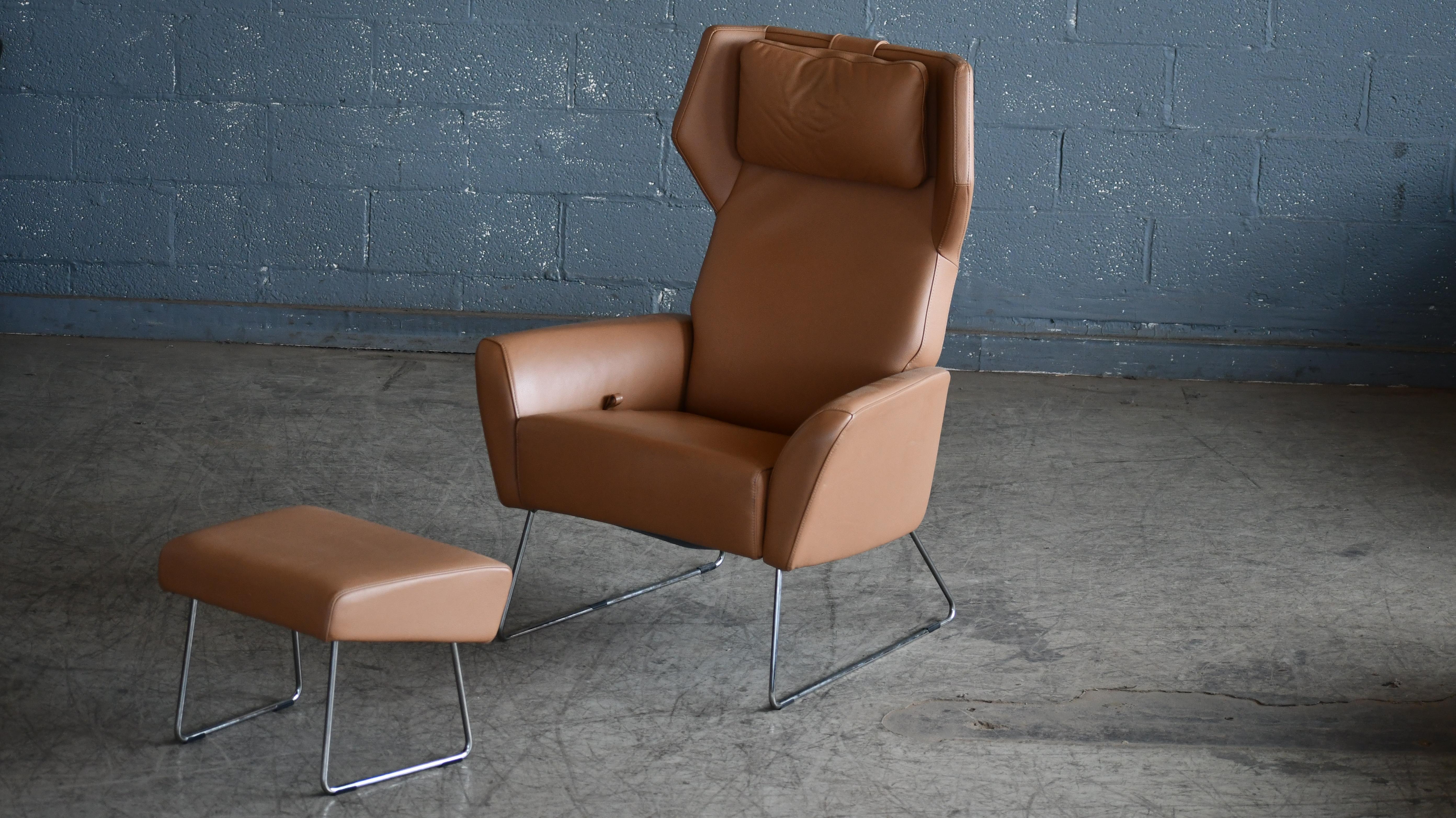Beautiful highback lounge chair with ottoman designed by Roger Person for Swedese in 2005. Soft aniline leather. Pulmaflex suspension (piston based  suspension system) that allows the backrest to recline and chair filled with cold foam and fiberfill