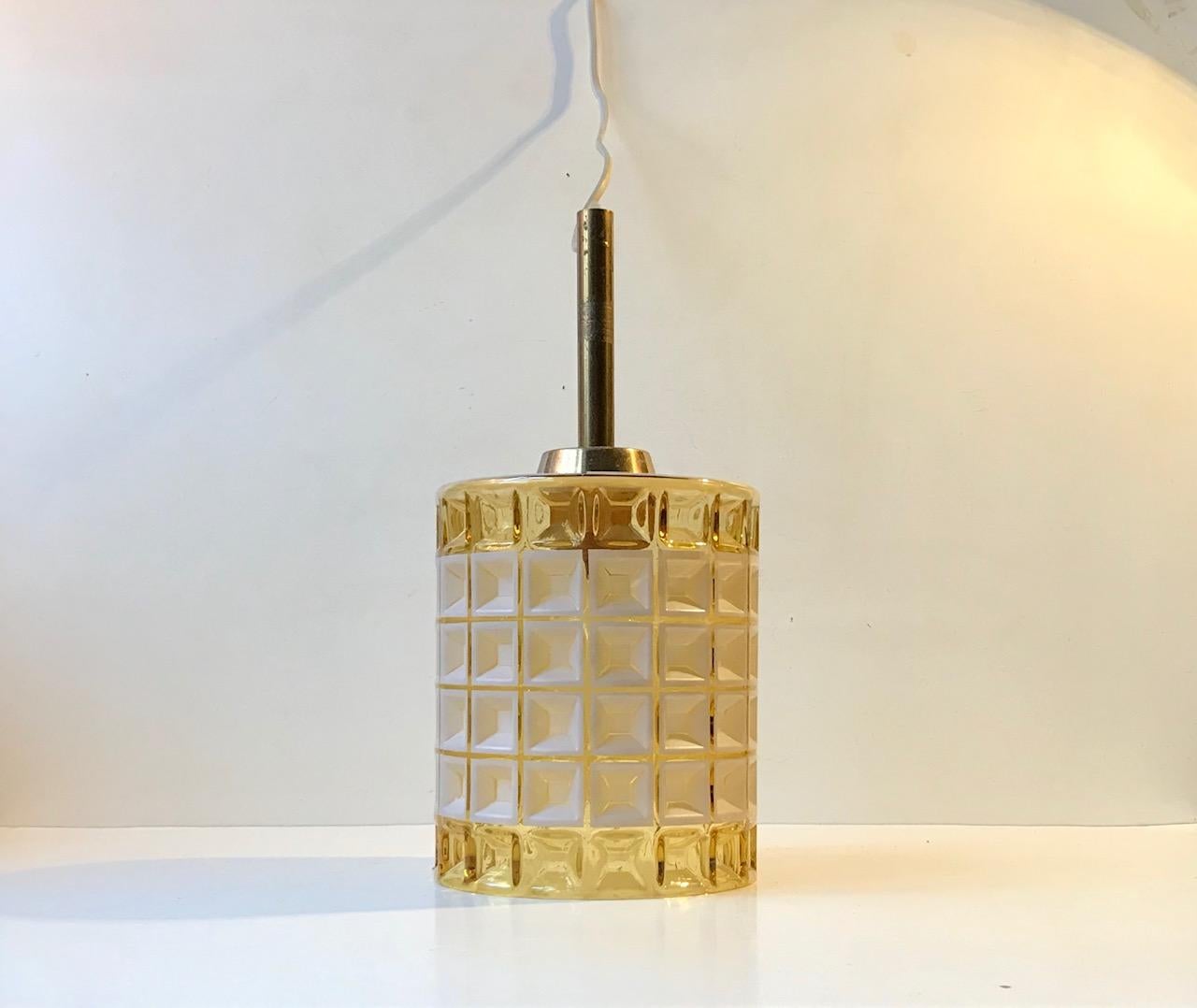 Pendant light designed and manufactured by the Danish design trio Vitrika in the 1960s. The name Vitrika, or Vi-Tri-Ka means 'The three of us can do it'. The lamp features a geometric - patterned clear glass shade. It for obvious reasons called