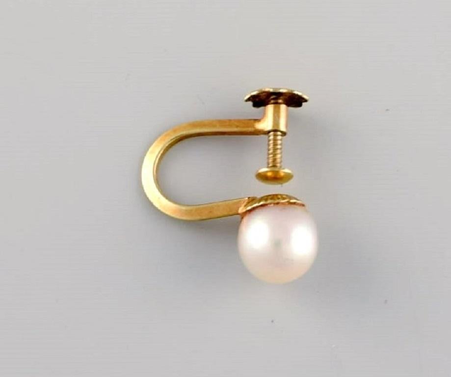 Scandinavian jeweler. A pair of classic earrings in 14 carat gold with cultured pearls. Mid-20th century.
Measures: 18 x 13 mm.
In excellent condition.
Stamped.