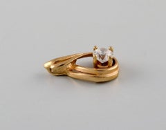 Scandinavian jeweler. Pendant in 14 carat gold adorned with semi-precious stone.