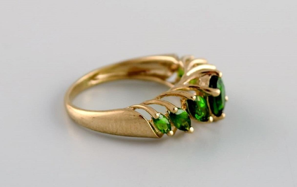 Scandinavian jeweler. Vintage alliance in 8 carat gold adorned with green semi-precious stones.
Mid-20th century.
Diameter: 17 mm.
US size: 6.5.
In excellent condition.
Stamped.
In most cases, we can change the size for a fee (USD 50) per ring.