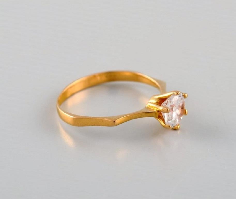 Scandinavian jeweler. Vintage ring in 21 carat gold adorned with brilliant. 
1920/30's.
Diameter: 18 mm.
US size: 7.75.
In excellent condition.
Stamped.
We can change the size for a fee (50 USD) per ring in most cases.