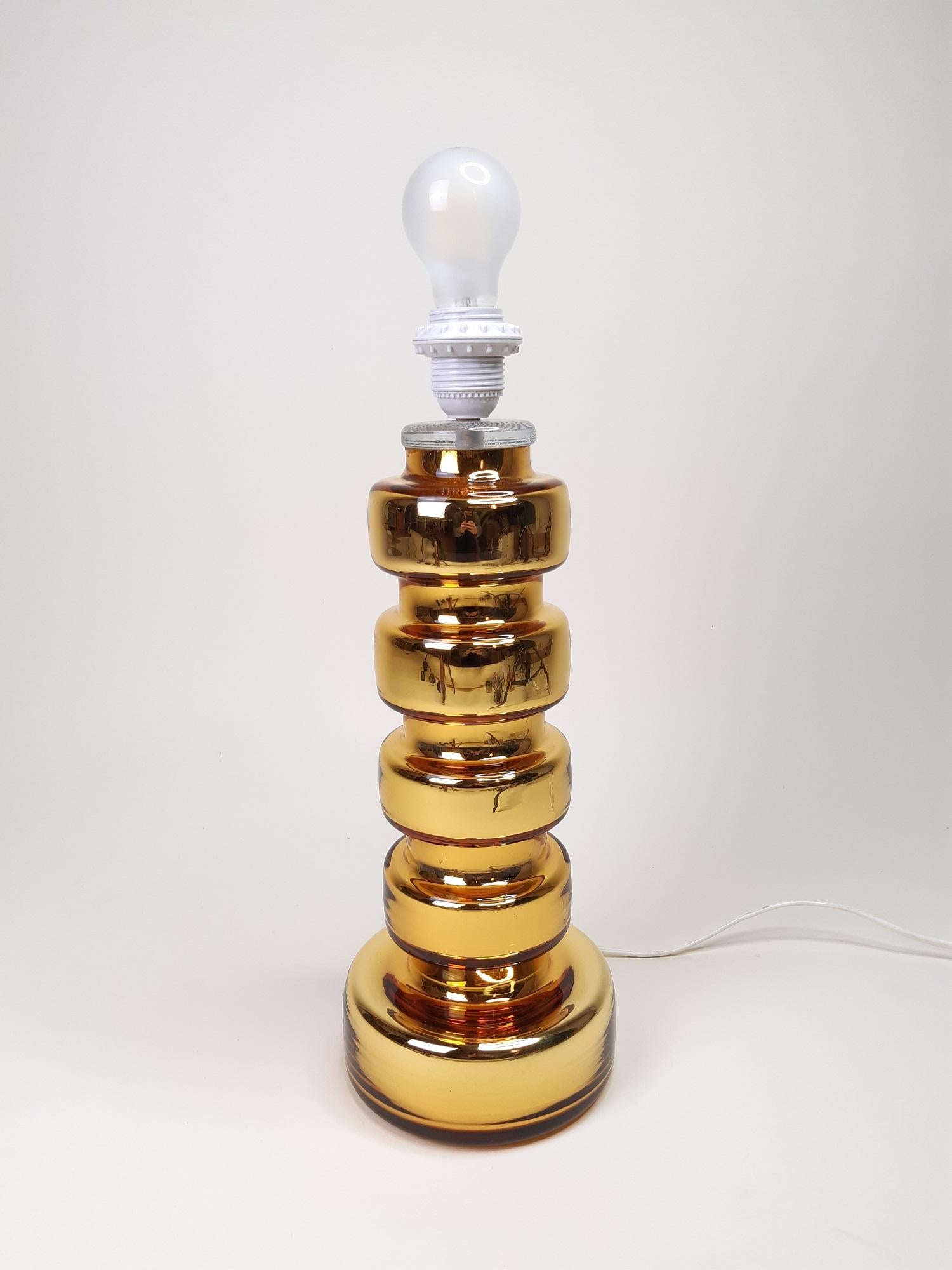 Scandinavian Johansfors glass table lamp, 1970s

Midcentury lamp by the Swedish manufacture Johansfors Glasbruk.

Measures: Socket height 45cm

Diameter 16cm and 12cm

Good condition, shade is not included.