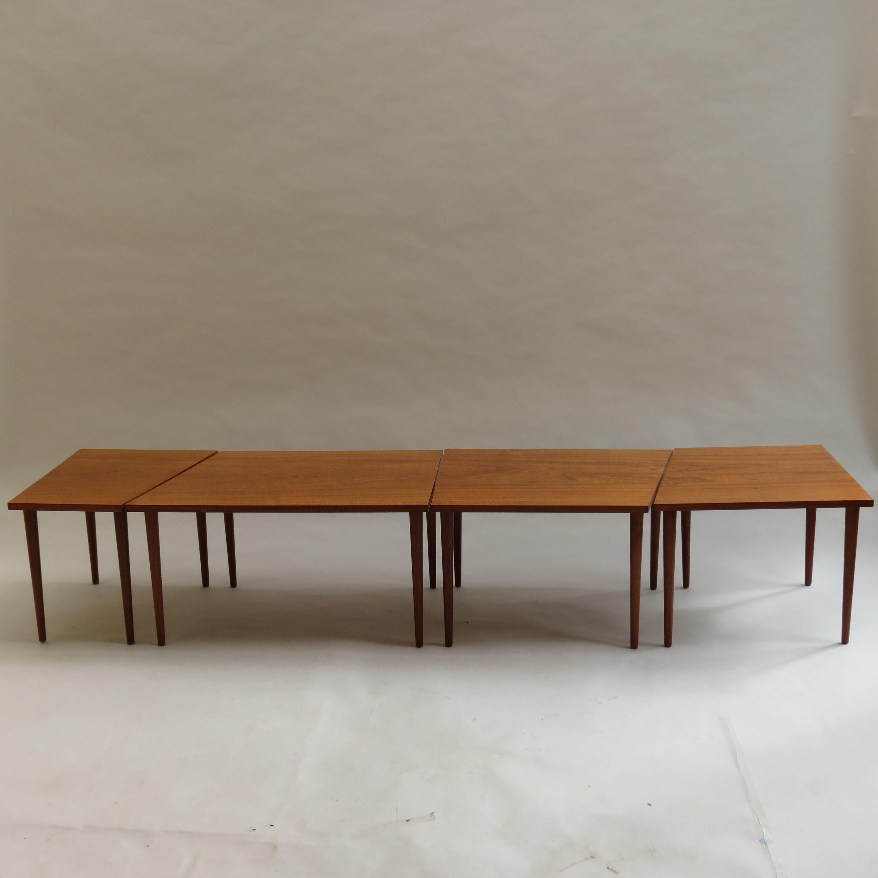 A very good quality teak coffee table, comprises 4 separate tables that sit together to form a long coffee table. Can also be placed in many configurations. Could be set up as a coffee table and 2 side tables, set up in an L shape to sit with a