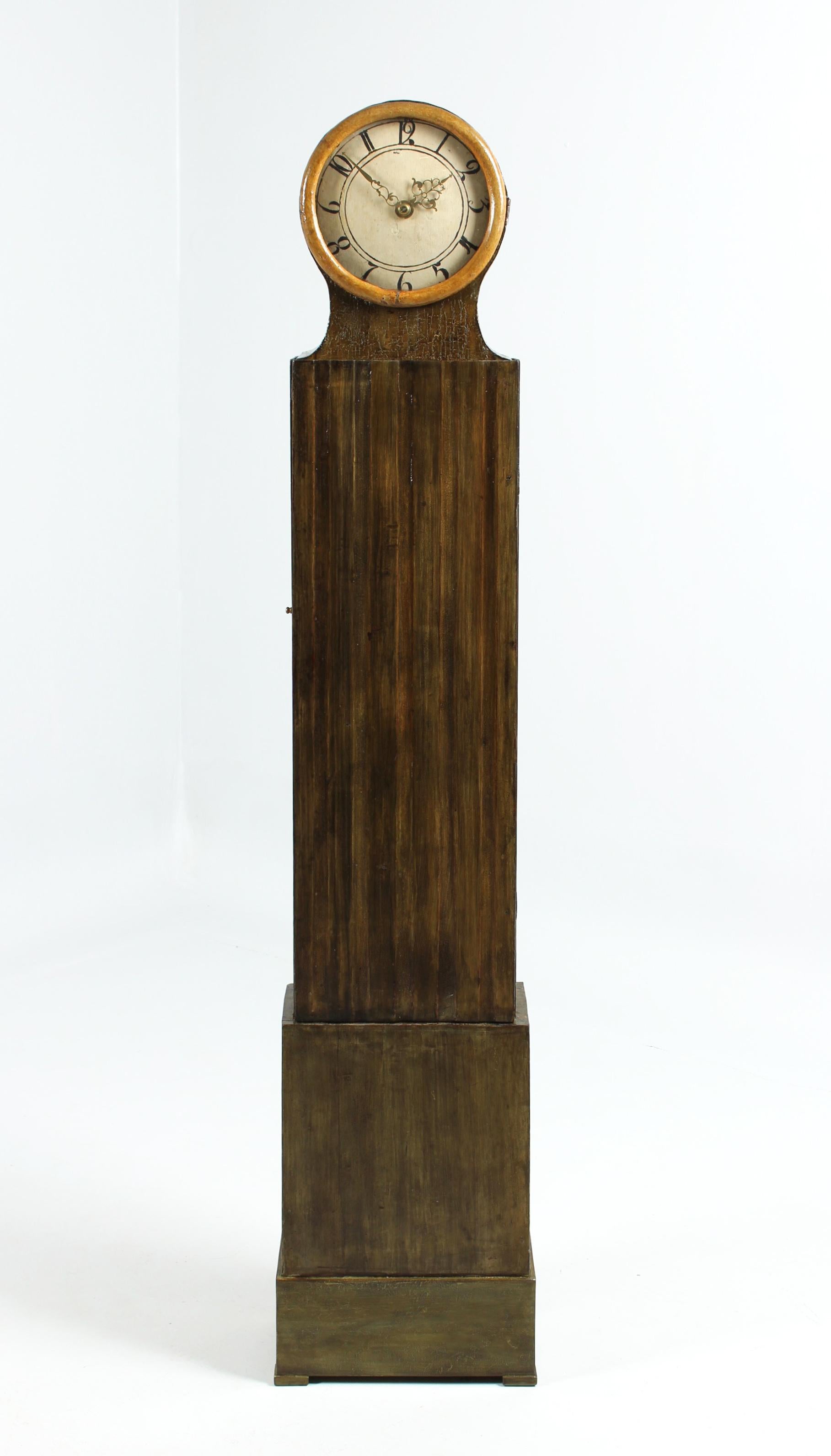 Small Scandinavian grandfather clock

Sweden
Wood, coloured
18th century

Dimensions: H x W x D: 187 x 38 x 21 cm

Description:
Stepped case standing on a plinth.
Straight box with round top. Dark green colour finish. Fluted centre section.
Painted