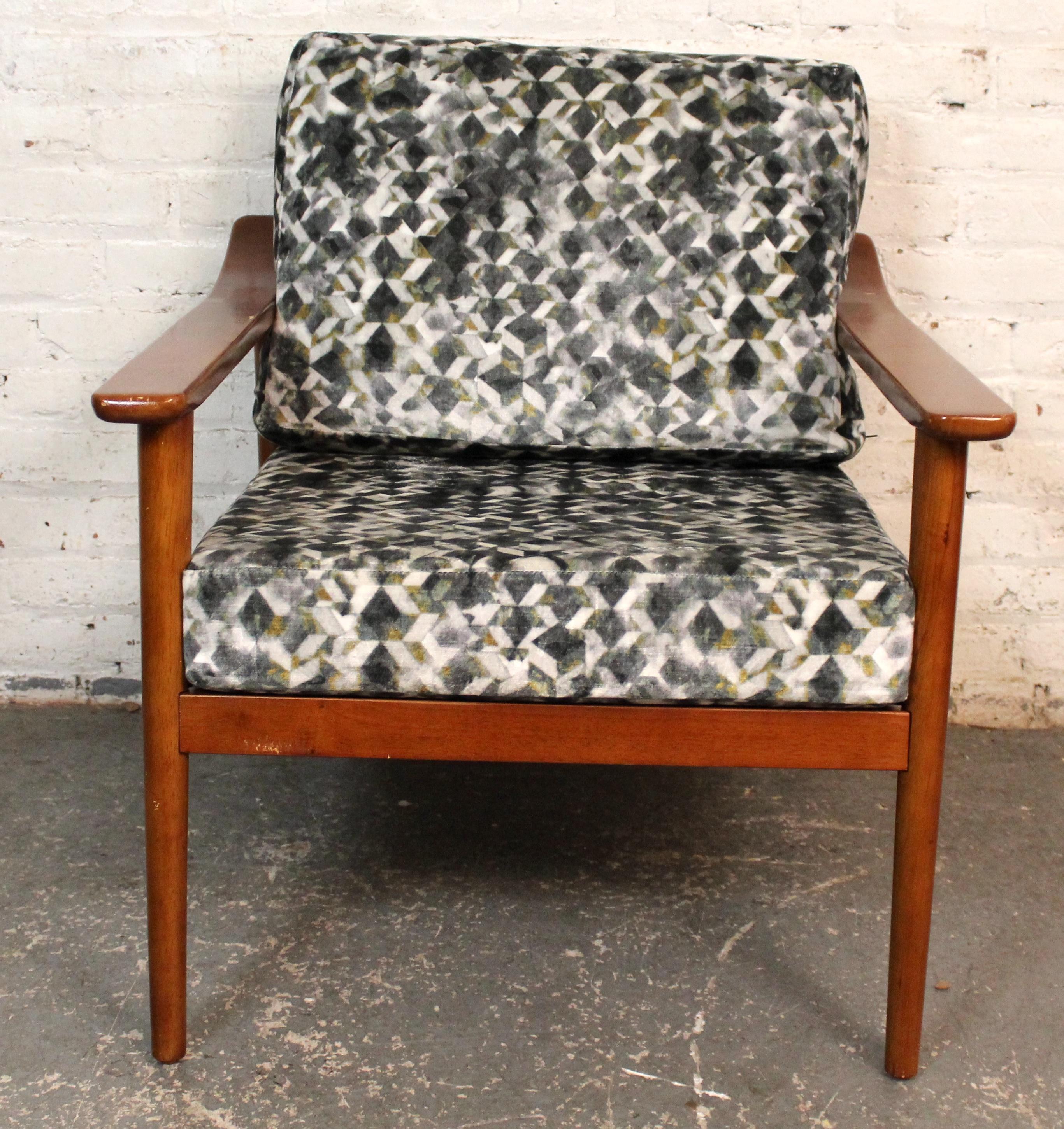 Blending modern glamour with Nordic simplicity, this Scandinavian-style lounge chair by Jonathan Adler features clean lines, tapered legs, and plush upholstery. A fresh take on mid-century design, it brings bold personality and timeless comfort to