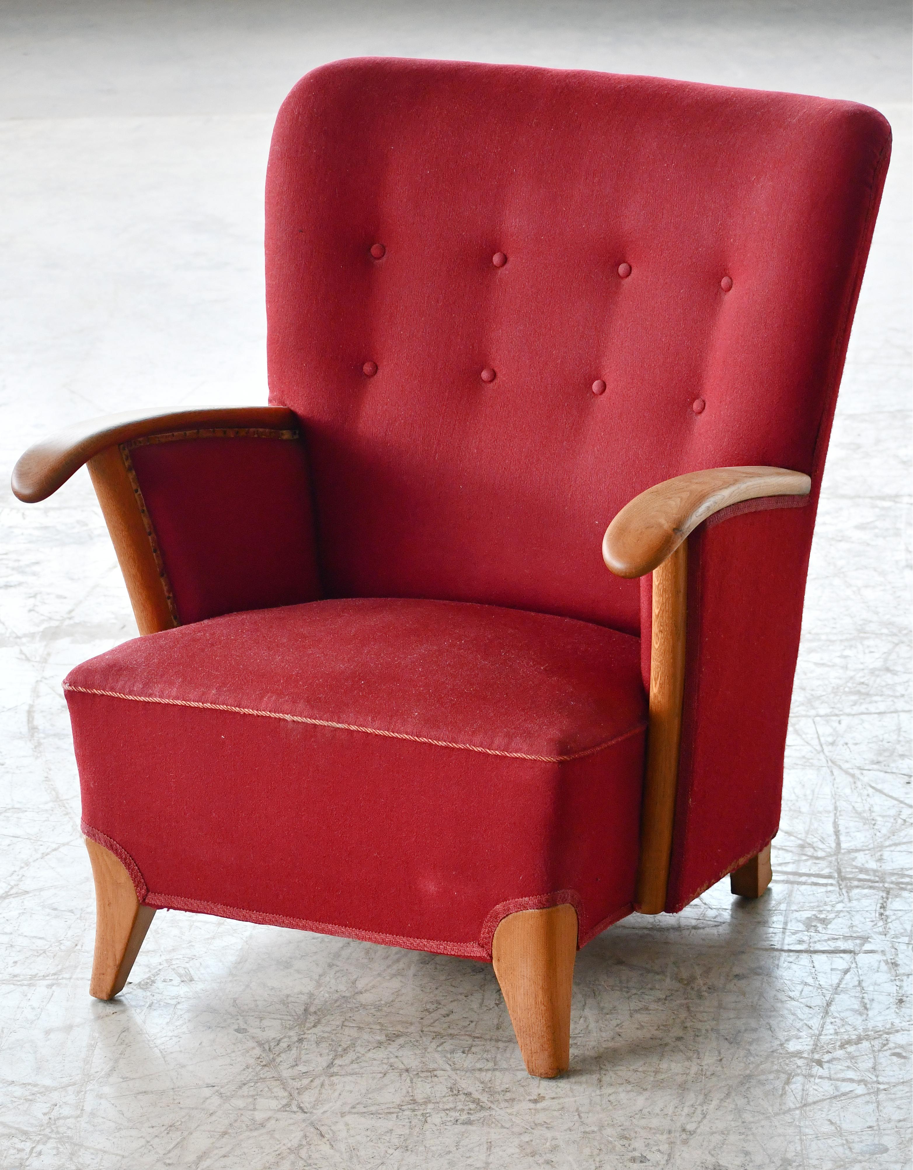Elegant and unusual lounge chair from the 1940's  in the style of Swedish Designer, Carl Malmsten. We have never seen any other examples of this chair and it may well be a one-of-a- kind chair by a Danish Cabinetmaker. Armrests and base made form