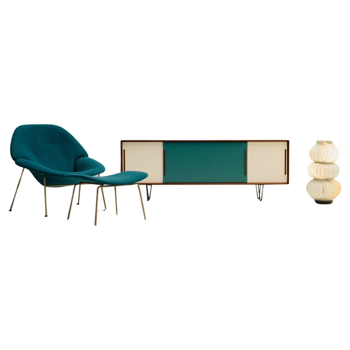 Scandinavian low and tight Sideboard relooked with 3 sliding doors in softwood. 

This stunning little one is based on a thin hardwood structure wich holds the different panels in rich veneer in between. The body sits on 4 light blackened rough iron