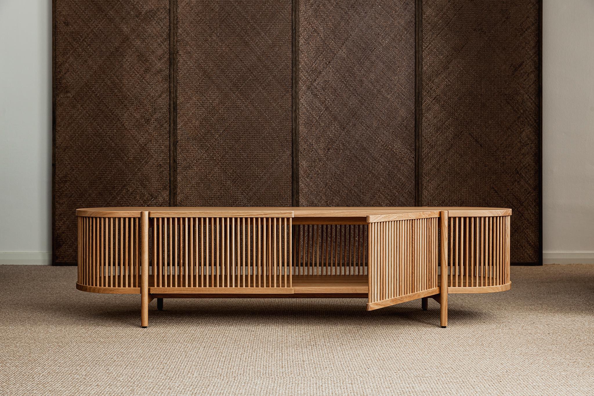 Low sideboard Bastone // Oak 
Designed by Antrei Hartikainen, 2022

Dimensions : H. 50 cm / W. 200 cm / D. 53 cm

Model shown in the picture : 
- Color : Oak 
- With doors

Designed by the award-winning master cabinet maker and designer