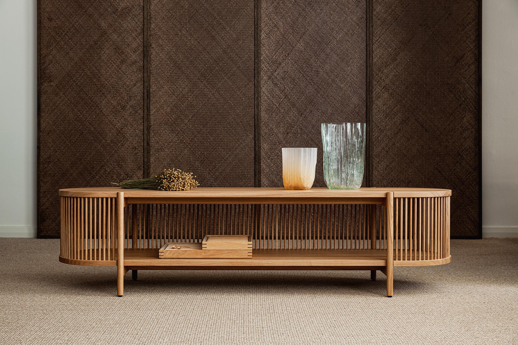 Low sideboard Bastone // Oak 
Designed by Antrei Hartikainen, 2022

Dimensions : H. 50 cm / W. 200 cm / D. 53 cm

Model shown in the picture : 
- Color : Oak 
- Without doors

Designed by the award-winning master cabinet maker and designer