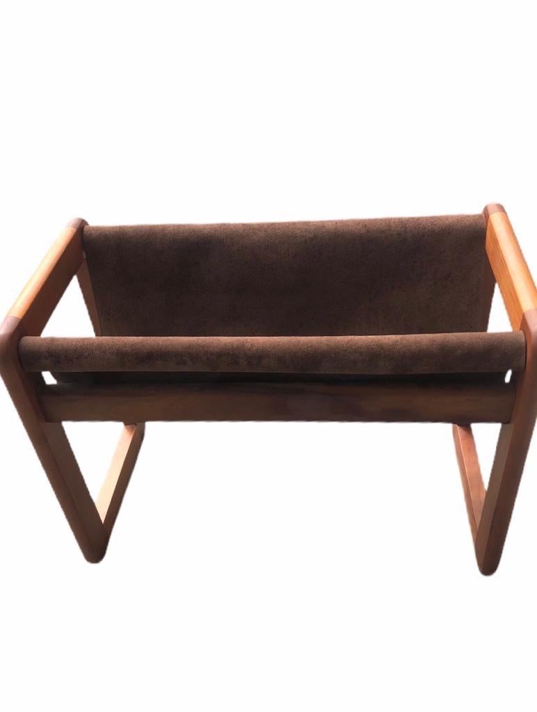 A teak and suede magazine rack signed Askel Kjersgaard (Denmark).