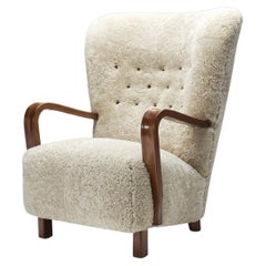 Scandinavian Mahogany Armchair in Sheepskin, Scandinavia, ca 1950s