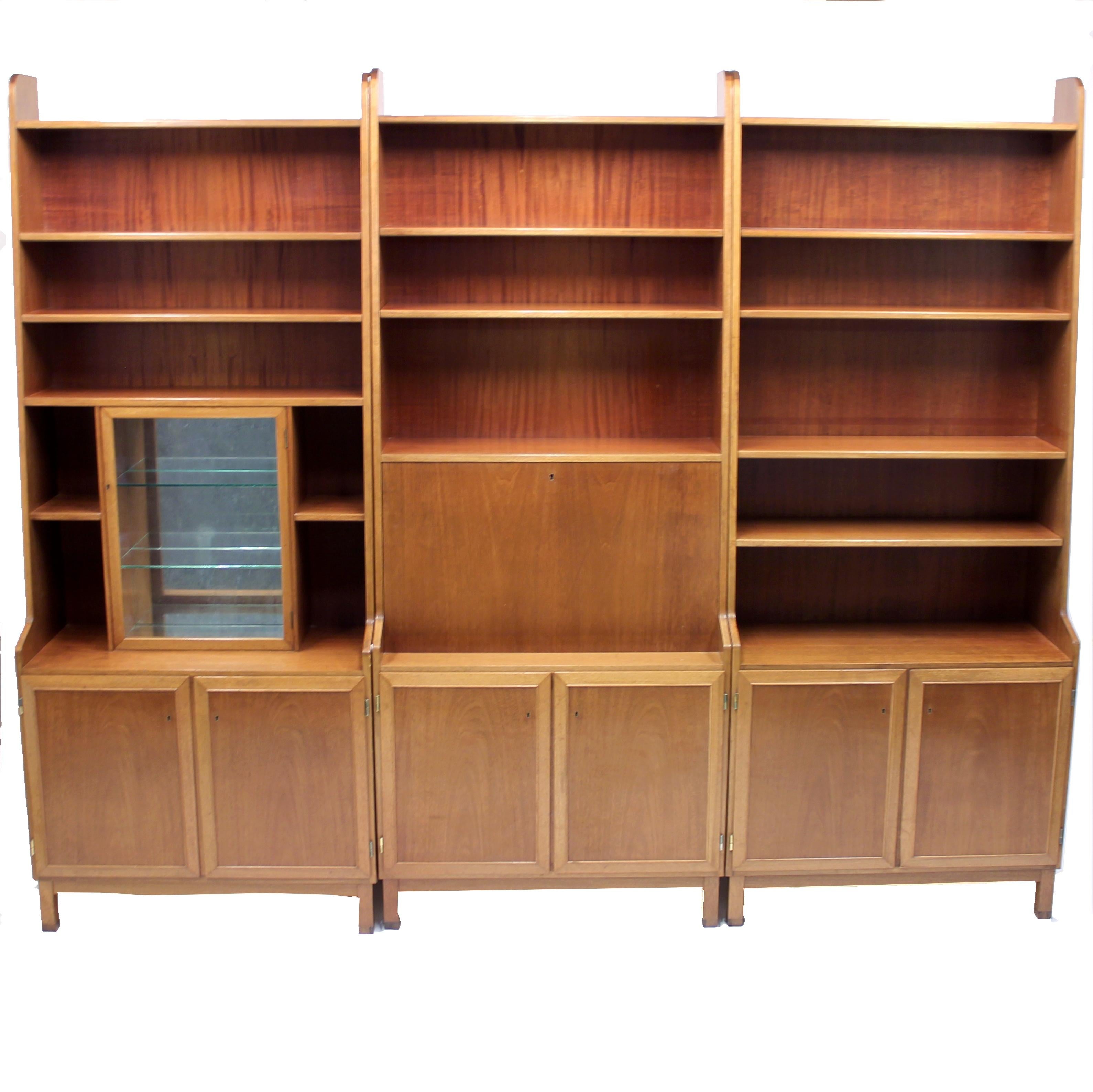 3-piece teak and mahogany handmade bookshelf by unknown Scandinavian master cabinet maker. Most likely a special order due to the very high level of craftsmanship and attention to details. It's also are a bit higher than the norm measuring 220 cm in