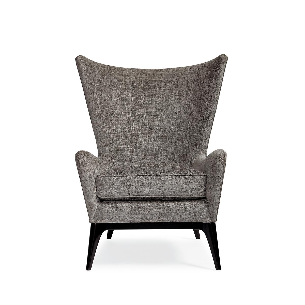 Scandinavian Mid Century armchair, this unique wing chair truly embodies Scandinavian style with the element of the wood detail across the outback finished in Almost Black. Its gracefully sloped arms and soft round back embrace you for cozy comfort