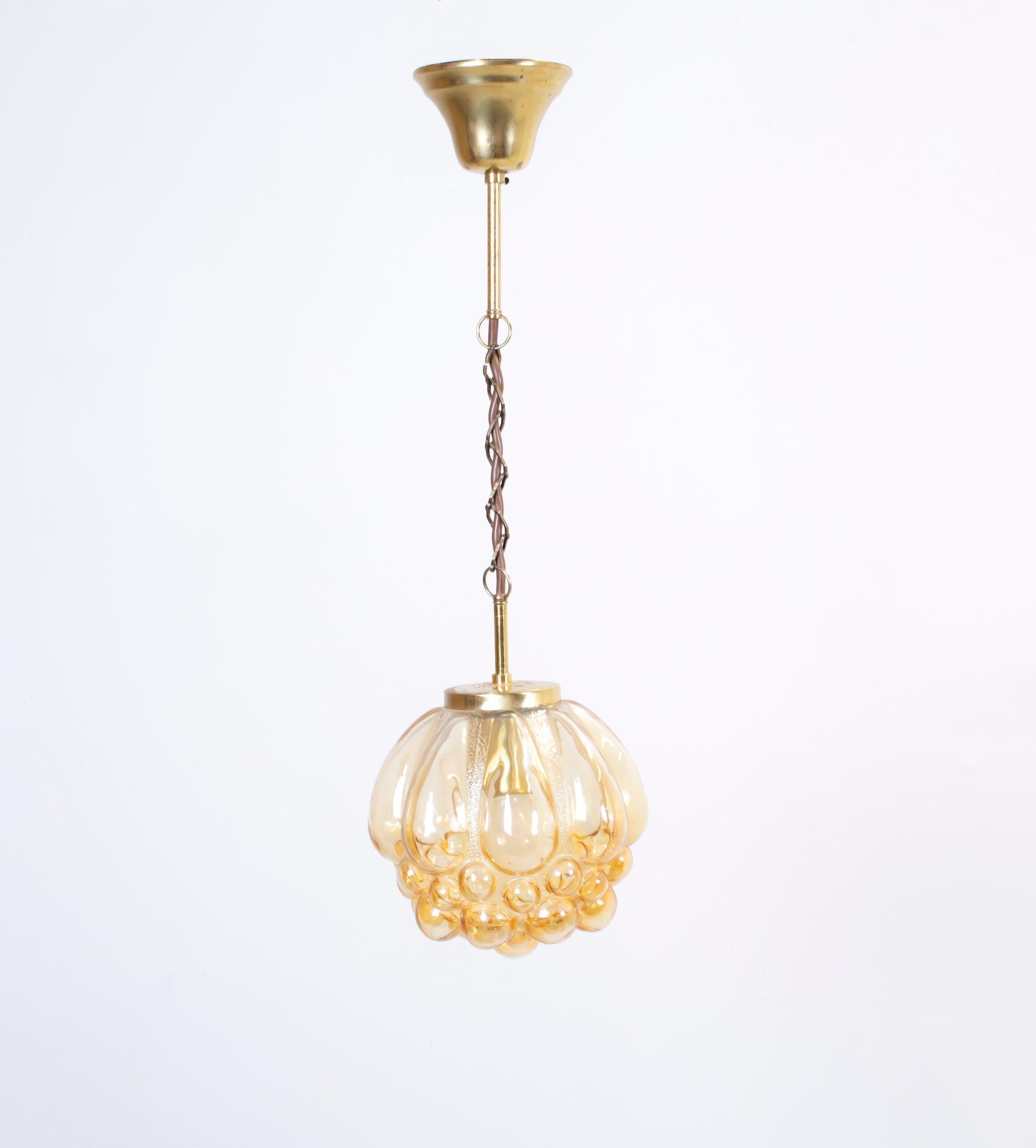 Decorative ceiling lamp in brass with shade in bubble glass. Designed and made in Norway from circa 1970s first half. The lamp is fully working and in good vintage condition. The lamp is fitted with one E27 bulb holder (works in the US), with a max