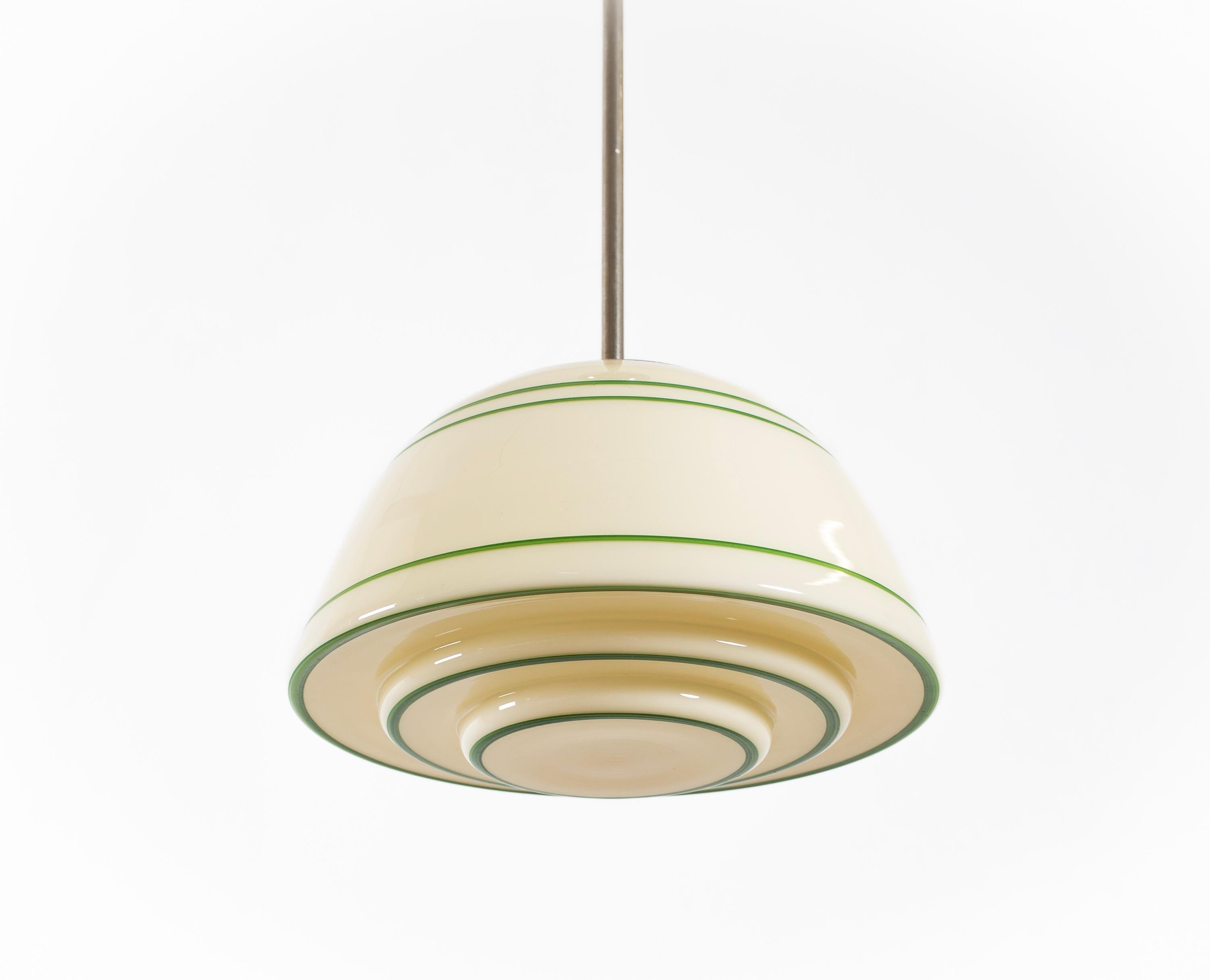 Modernist ceiling light in chrome with decorated shade in blown glass. Designed and made in Norway from cirka 1950s second half. The lamp is fully working and in good vintage condition. It is fitted with one E27 bulb holder (works in the US), with a