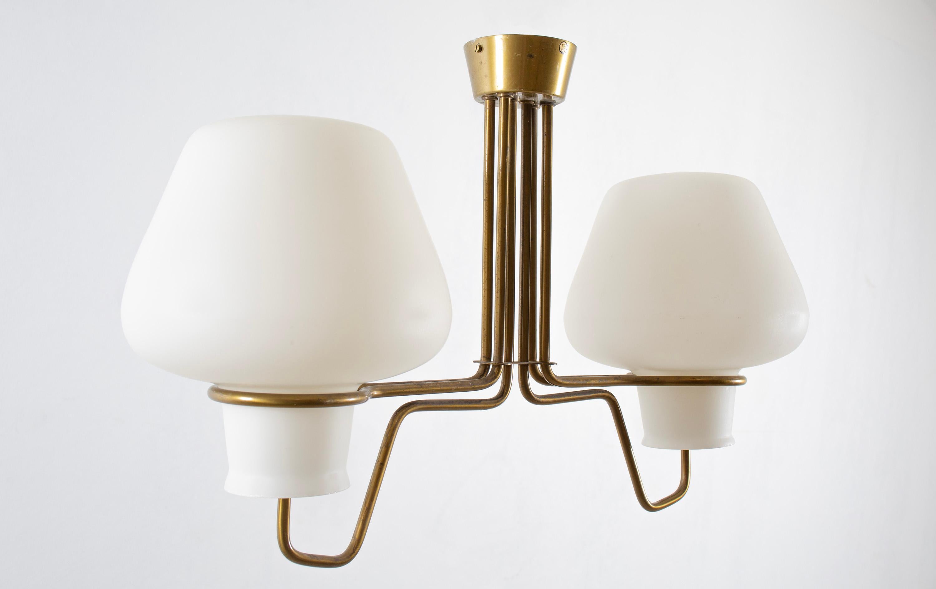 Large modernist ceiling light in brass with shades in opaline glass. Designed and made in Norway from cirka 1960s first half. The lamp is fully working and in good vintage condition. It is fitted with two E27 bulb holders (works in the US), with a