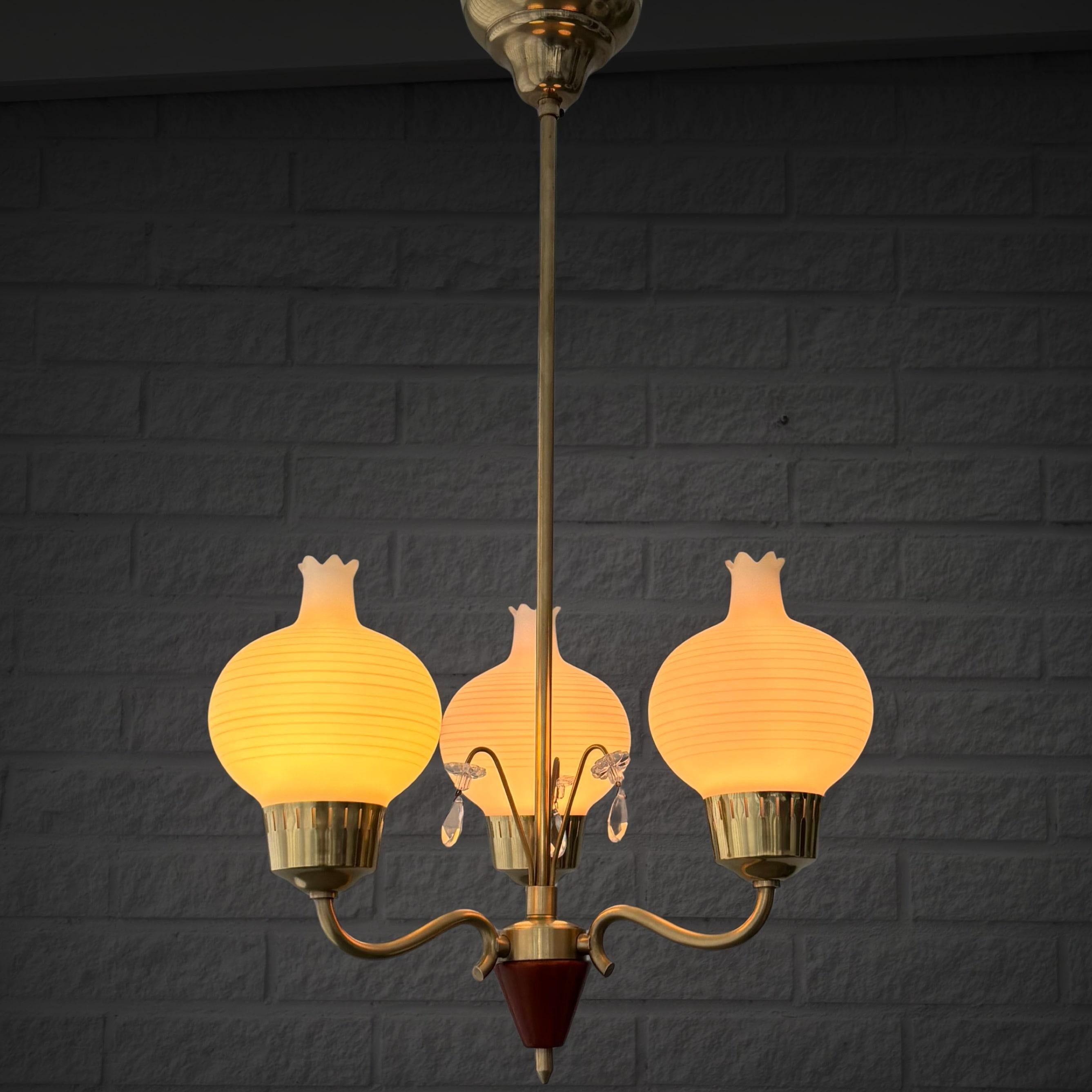 Scandinavian Modern Scandinavian mid-century chandelier, brass with crystal prisms, Sweden, 1940s