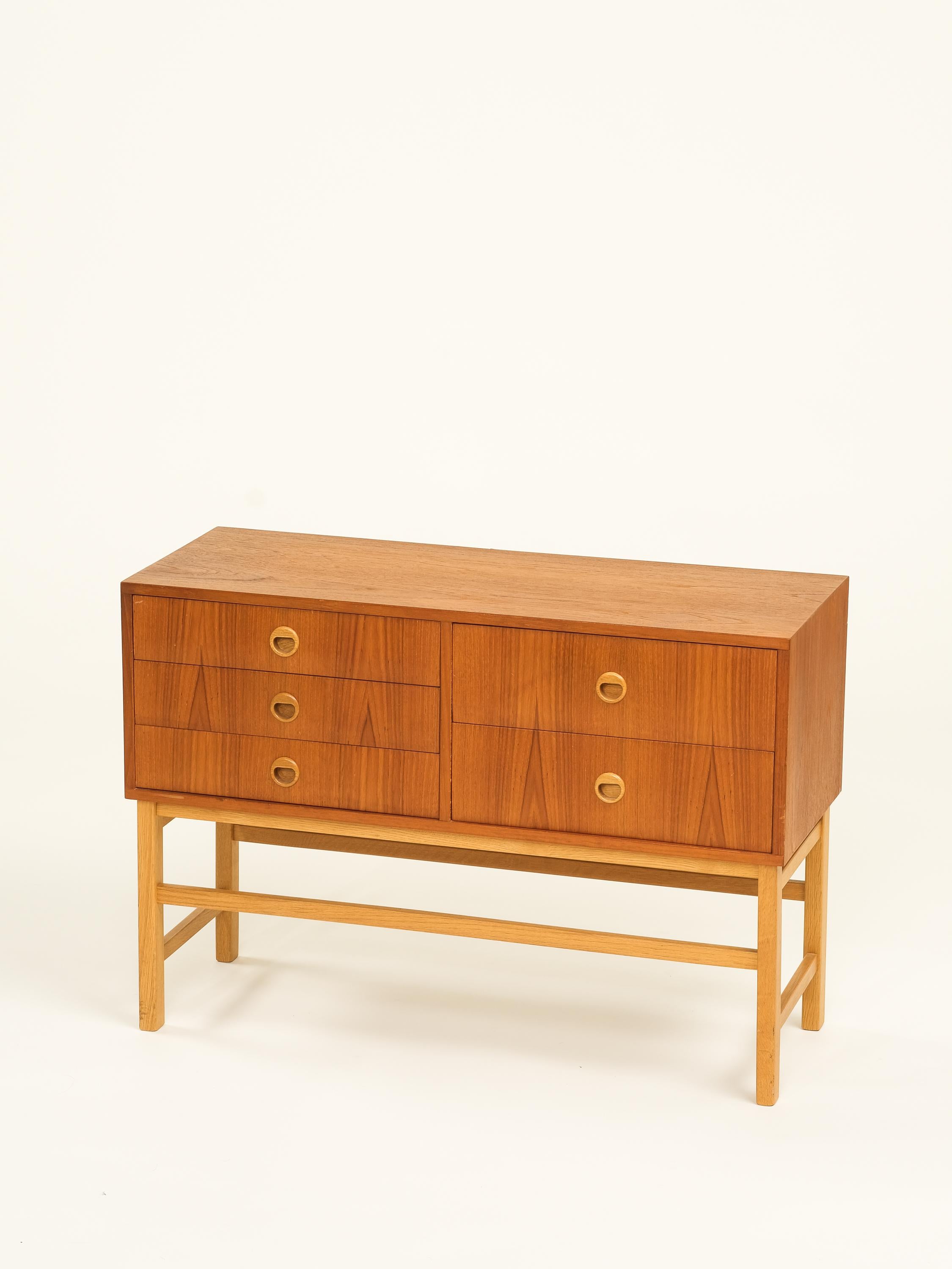 Scandinavian mid-century three drawer console table in teak. Sleek design and ample storage make it a perfect addition to any living space.